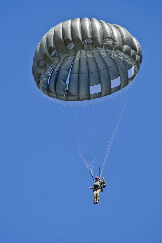 A U.S. soldier descends during a static-line training jump over Soto Cano Air Base in Honduras, Jan. 11, 2016. U.S. Air Force photo by Capt. Christopher Mesnard