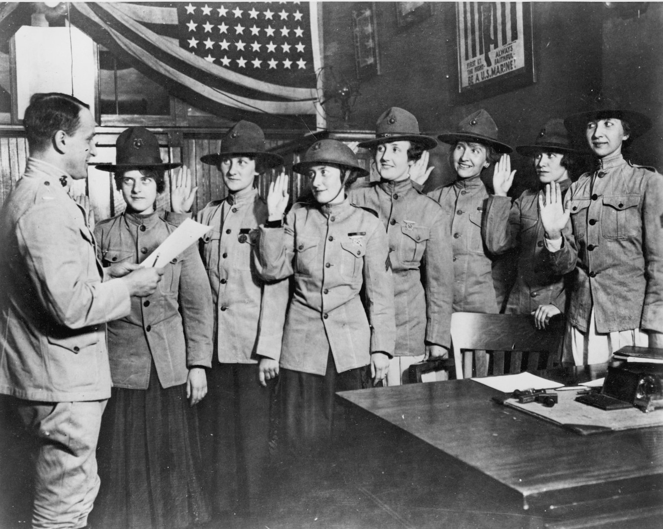 These are the eight women admitted as privates in the United States Marine Corps who are going to Washington as enlisted “stenos” in the office of the Marine Corps Adjutant. With Lieutenant George Kneller, who swore them in, they are from left to right:  Violet Van Wagner, Brooklyn; Marie S. Schleight, Glendale, L.I.; Florence Wiedinger, Jersey City; Isabelle Balfour, Janet Kurgan, Edith Barton, and Helene Constance Dupont, whose husband is a sergeant in France.  Mrs. Dupont and Miss Kurgan are sisters.
DEFENSE DEPT PHOTO (MARINE CORPS) 530552
