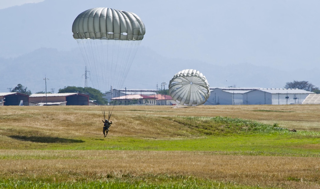 A U.S. soldier prepares to land during a static-line training jump over Soto Cano Air Base in Honduras, Jan. 11, 2016. U.S. Air Force photo by Capt. Christopher Mesnard