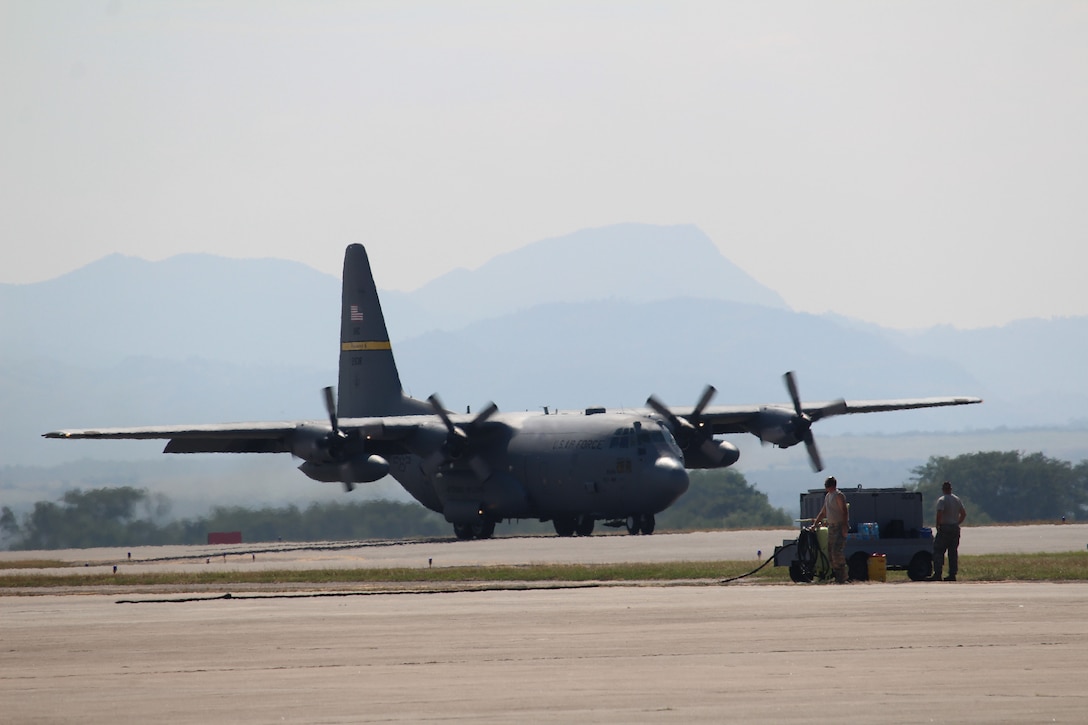 A C-130H Hercules aircraft lands for a refueling on Soto Cano Air Base, Honduras, Jan. 11, 2016, after a static-line training exercise. U.S. Army photo by Maria Pinel