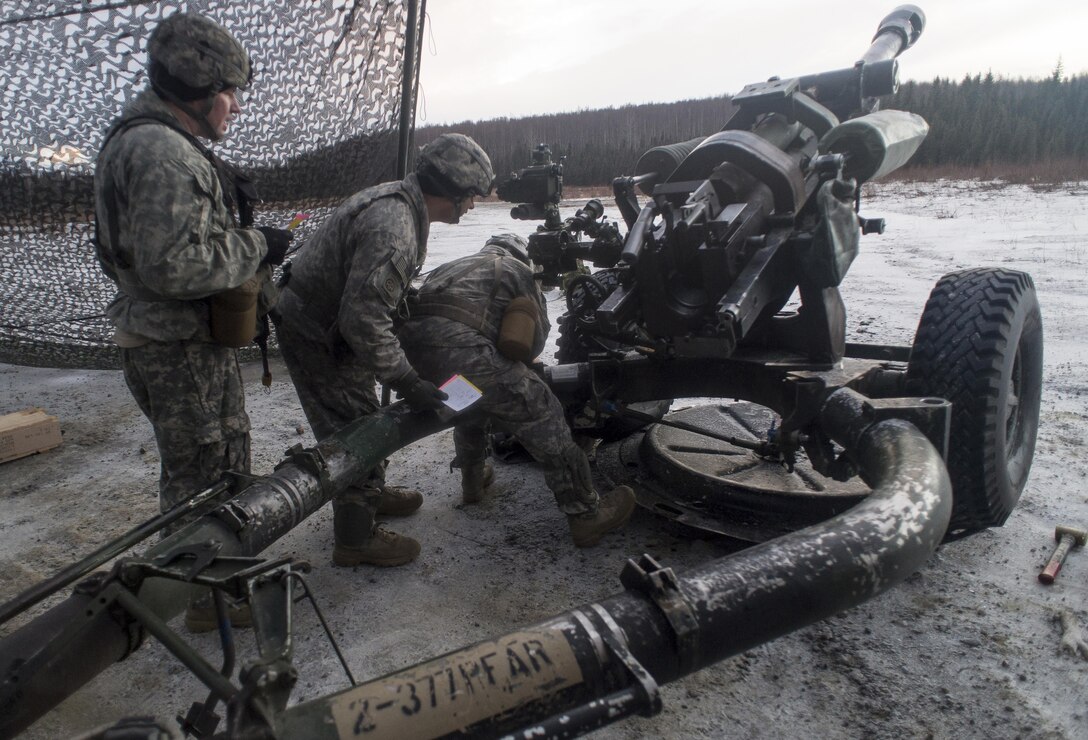 Paratroopers prepare an M119A2 105 mm howitzer for a live-fire exercise on Joint Base Elmendorf-Richardson, Alaska, Jan. 11, 2016. U.S. Air Force photo by Justin Connaher