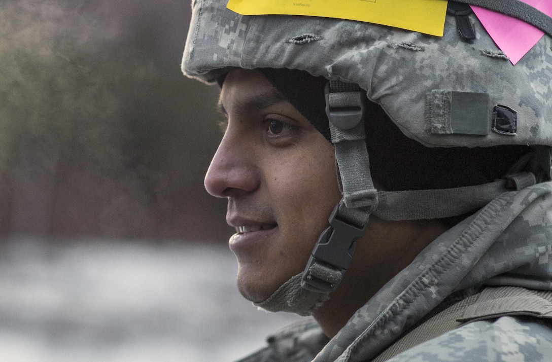 Army Sgt. Estevan Rodriguez waits for the order to fire an M119A2 105 mm howitzer during a live-fire exercise on Joint Base Elmendorf-Richardson, Alaska, Jan. 11, 2016. U.S. Air Force photo by Justin Connaher