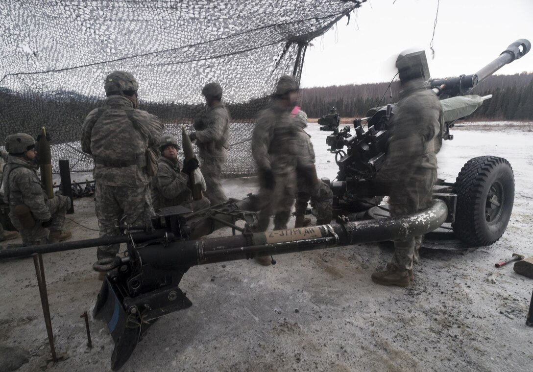 Paratroopers participate in a howitzer live-fire exercise on Joint Base Elmendorf-Richardson, Alaska, Jan. 11, 2016. U.S. Air Force photo by Justin Connaher