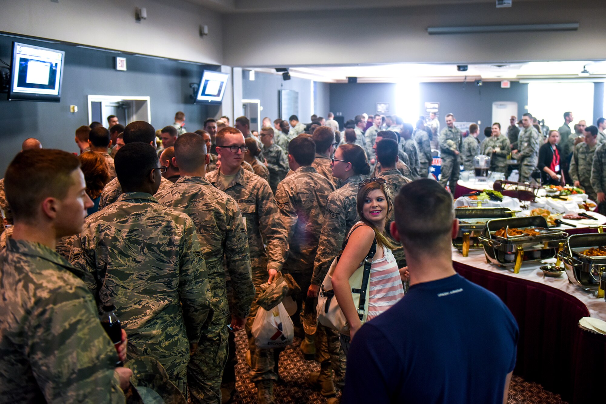 Base members visit various social club booths during the Make Goodfellow Great Kick-Off Party at the Event Center on Goodfellow Air Force Base, Texas, Jan. 14, 2016.  Goodfellow members created the social clubs as part of the MGG initiative encouraging social interaction within the base community. (U.S. Air Force photo by Senior Airman Devin Boyer/Released)