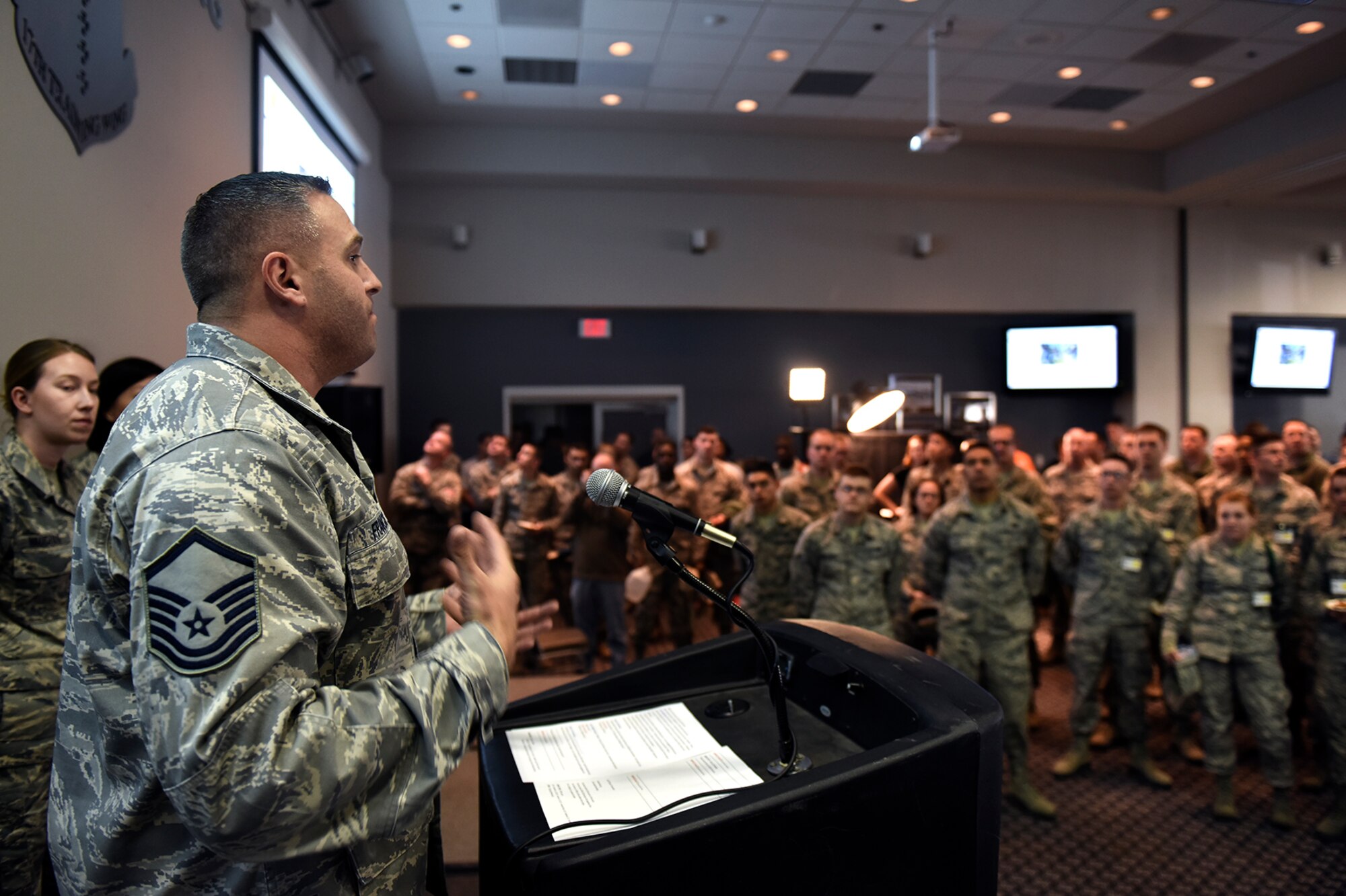 U.S. Air Force Master Sgt. Christopher J. Francis, 17th Contracting Squadron base infrastructure flight NCO in charge, speaks to base members during the Make Goodfellow Great Kick-Off Party at the Event Center on Goodfellow Air Force Base, Texas, Jan. 14, 2016. Francis explained the purpose for the MGG initiative and encouraged individuals to join and start clubs that interest them. (U.S. Air Force photo by Senior Airman Devin Boyer/Released)