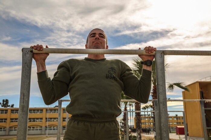 Lance Cpl. Matthew P. Chaves, Kilo Company, 3rd Recruit Training Battalion, executes pull-ups during a physical fitness session at Marine Corps Recruit Depot San Diego, Jan. 11. After graduation, Chaves will attend the School of Infantry in Camp Pendleton, Calif., where he will pursue his military occupational specialty as an infantryman. Today, all males recruited from west of the Mississippi are trained at MCRD San Diego. The depot is responsible for training more than 16,000 recruits annually. Kilo Company is scheduled to graduate Jan. 15.