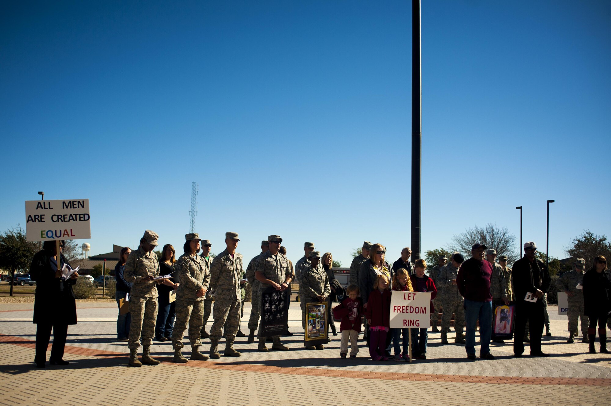 Goodfellow members stand together during the opening ceremony of the March on Goodfellow at the Norma Brown building on Goodfellow Air Force Base, Texas, Jan. 15, 2016. The event commemorated the marches Martin Luther King Jr. and his supporters led during the civil rights movement. (U.S. Air Force photo by Senior Airman Scott Jackson/Released)