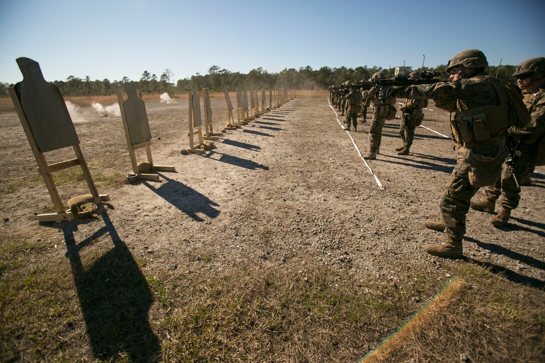 Marines with 2nd Combat Engineer Battalion engage targets during a Combat Marksmanship Program qualification event at Camp Lejeune, N.C., Jan. 13. The CMP shoot makes Marines simulate close-range, fire and maneuver combat operations to increase their speed and precision. (U.S. Marine Corps photo by Lance Cpl. Damarko Bones/Released)