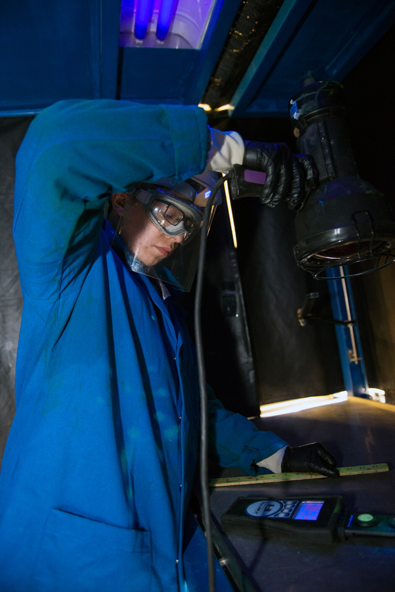 U.S. Air Force Airman 1st Class Tony Alviruzi, 23d Equipment Maintenance Squadron non-destructive unit fabrication flight journeyman, inspects a UV-ray radiometer Jan. 12, 2016, at Moody Air Force Base, Ga. Black lighting is used to detect cracks and damage to aircraft components that may not be seen by the naked eye. (U.S. Air Force photo by Airman 1st Class Greg Nash/Released) 
