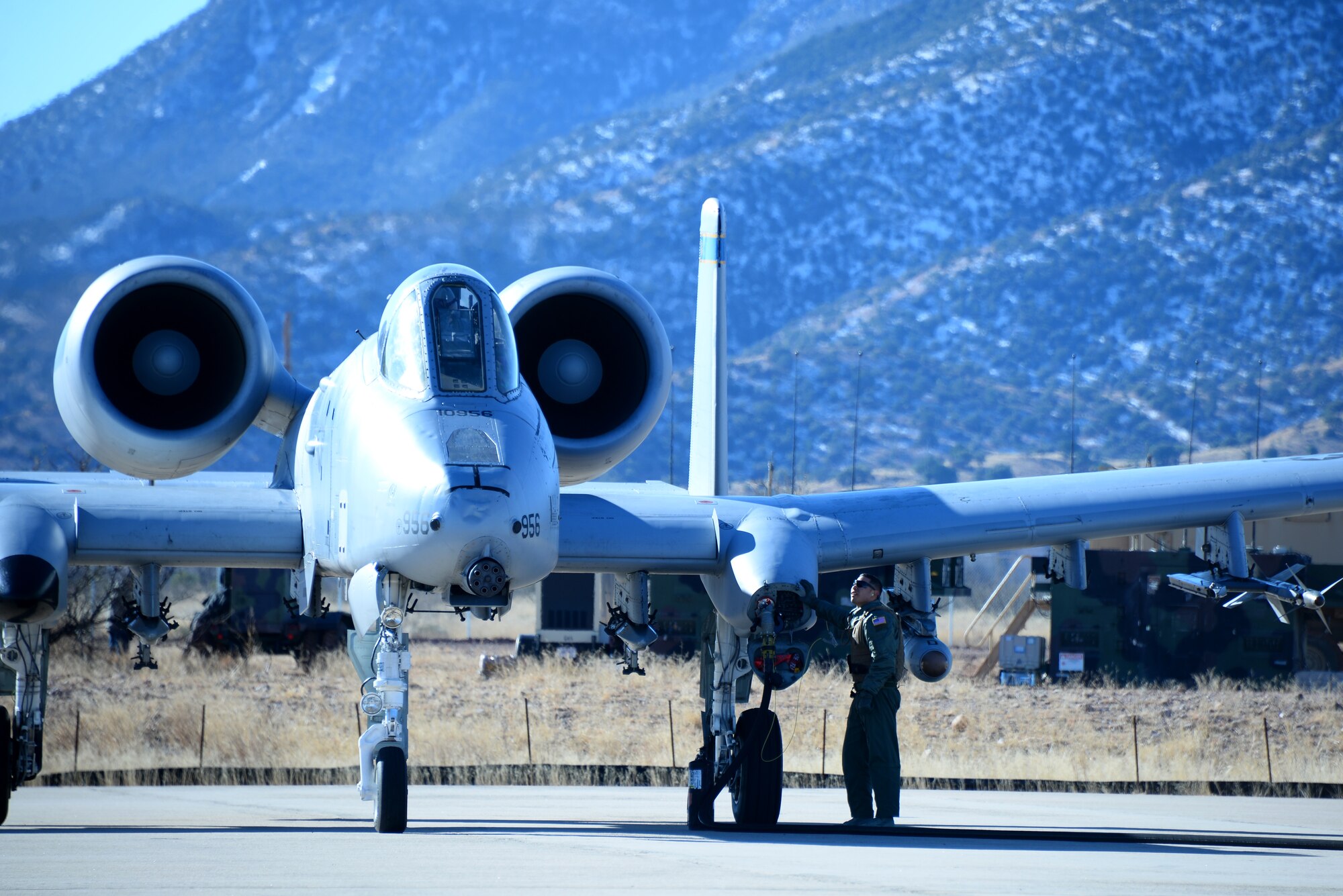 U.S. Air Force Tech. Sgt. Richard Apodaca, 355th Logistics Readiness Squadron Forward Area Refueling Point team chief, refuels an A-10 Thunderbolt II assigned to the 354th Fighter Squadron during FARP training at Fort Huachuca, Ariz., Jan. 13, 2016. The FARP training was part of Cactus Flag: a large force employment exercise.  (U.S. Air Force photo by Airman 1st Class Mya M. Crosby/Released)