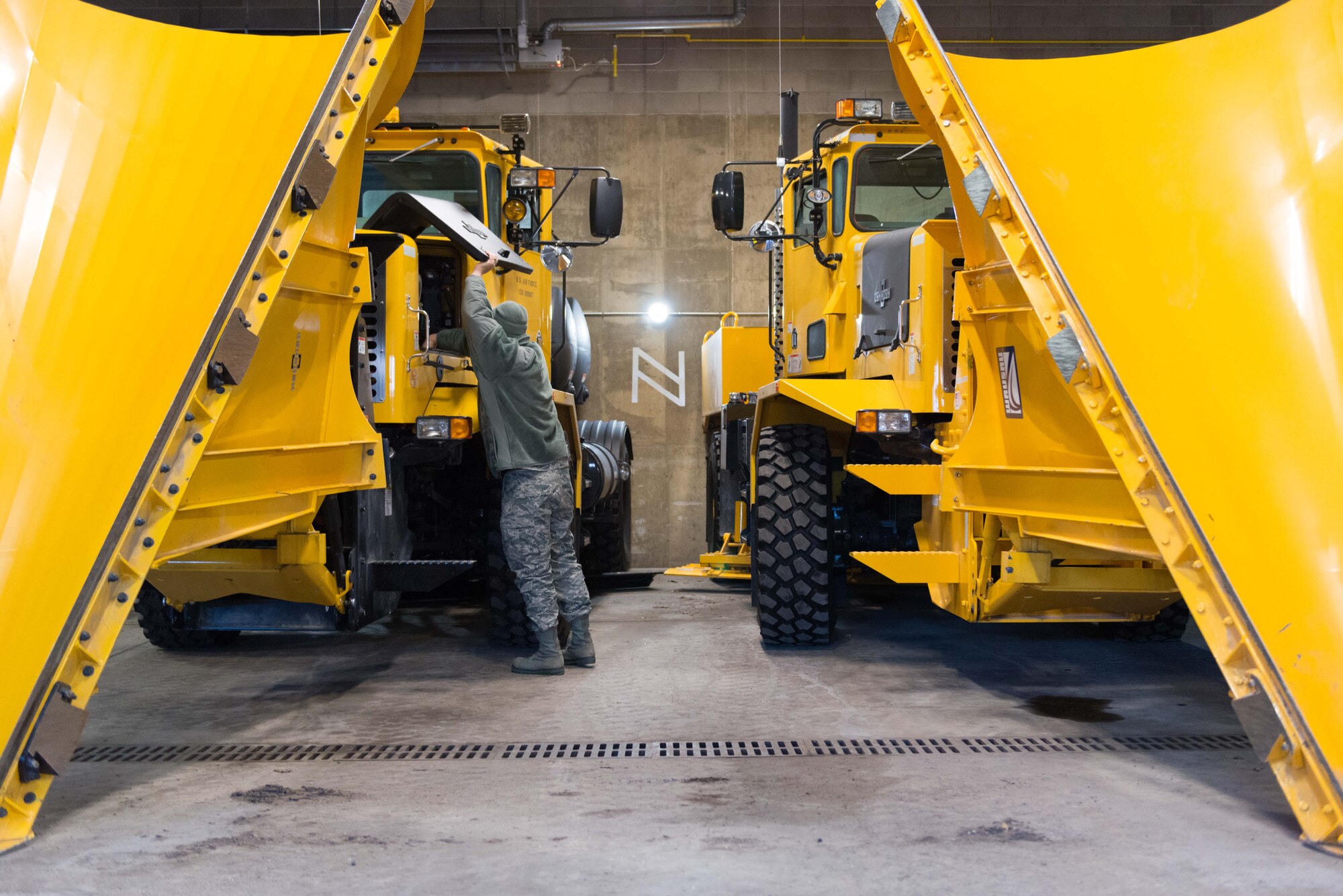 Tech. Sgt. Adam Ruter, 934th Civil Engineer Squadron technician, performs an equipment check on an OshKosh rollover plow inside the Vehicle Operations bay at the Minneapolis-St. Paul Air Reserve Station on Jan. 10  (U.S. Air Force Photo by Staff Sgt. Trevor Saylor))