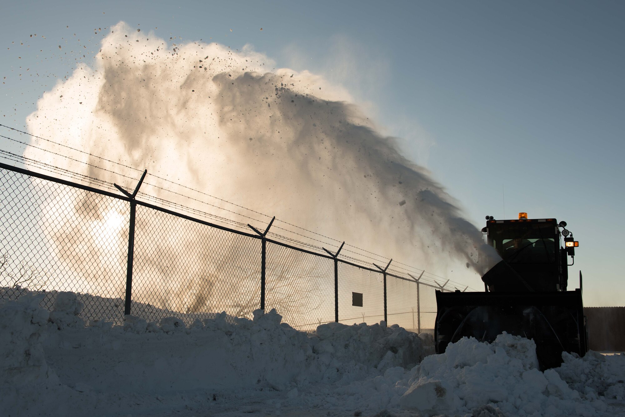 Staff Sgt. Eric Tegels, 934th Civil Engineer Squadron technician, uses a truck-mounted snowblower to clear snow at the Minneapolis-St.Paul Air Reserve Station on Jan. 10 (U.S. Air Force Photo by Staff Sgt. Trevor Saylor)