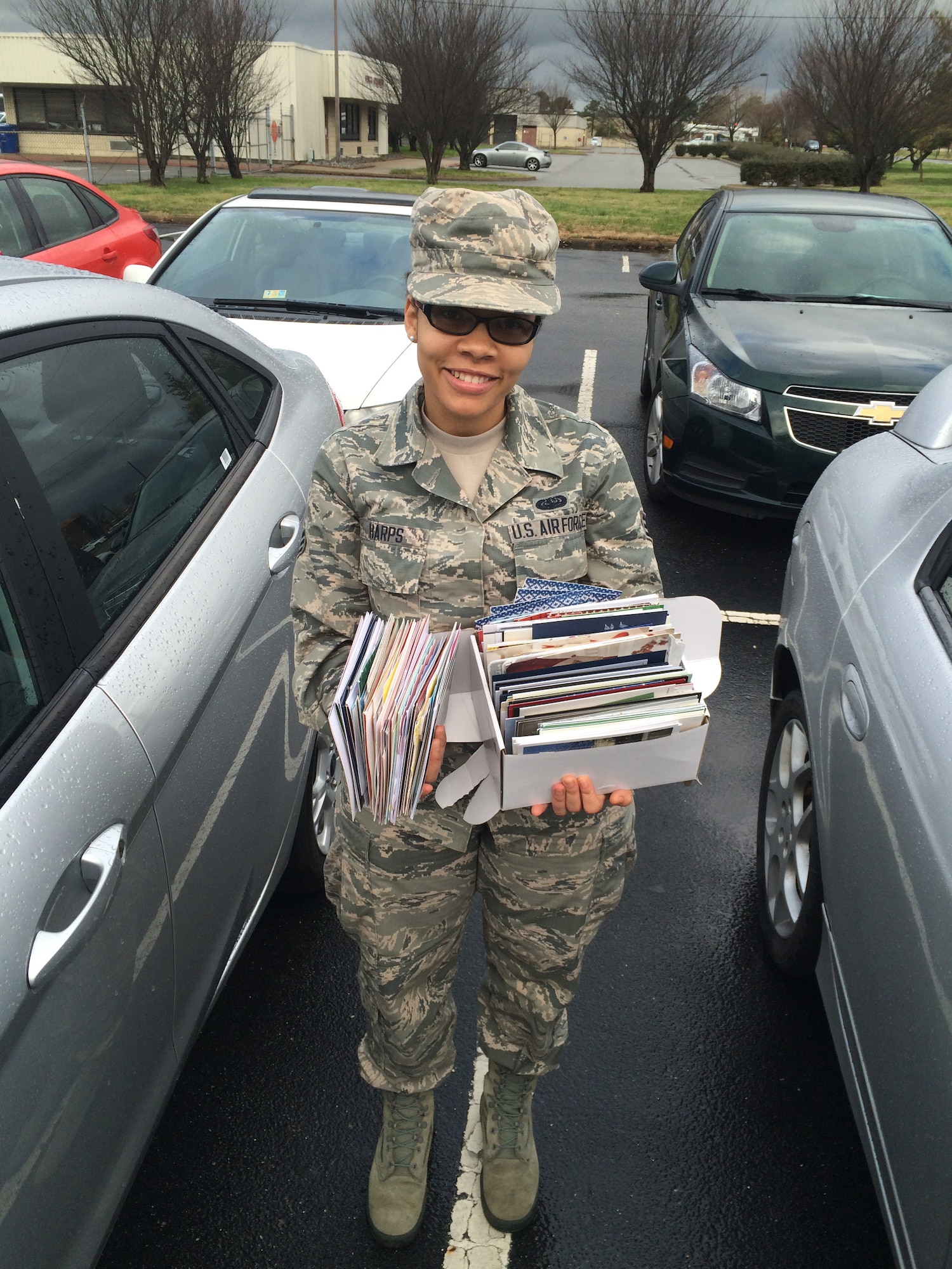 Senior Airman Monique Harps, a directory service technician assigned to the 860th Network Operations Squadron, holds the nearly 300 cards she and her unit collected for the St. Jude’s Ranch for Children’s Recycled Card Program during the January unit training assembly at Joint Base Langley-Eustis, Va.  According to the St. Jude’s Ranch for Children website, donations to the Recycled Card Program enables children at the Ranch to make new “green” cards by removing the front and attaching a new back, resulting in a beautiful new card. (U.S. Air Force photo)