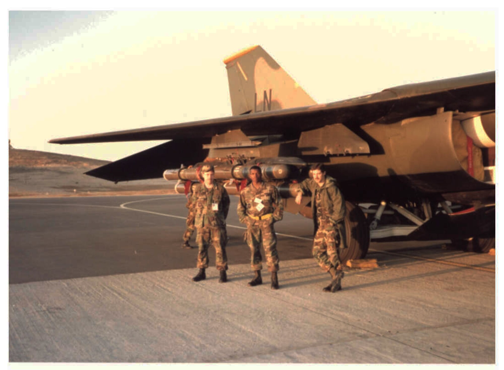 Chief Master Sgt. Terry Goines, 301st Fighter Wing command chief master sergeant, is pictured as an Airman 1st Class with fellow weapons load crew members Staff Sgt. Robert Arbogast (left) and Senior Airman Mark Reckers (right) during operations Desert Shield and Desert Storm in Southwest Asia. Goines served as a weapons load crewmember for the 48th Tactical Fighter Wing at Royal Air Force Lakenheath, United Kingdom, which was the first unit in the United States Air Forces in Europe to deploy in support of Operation Desert Shield. (U.S. Air Force photo courtesy of Chief Master Sgt. Terry Goines)