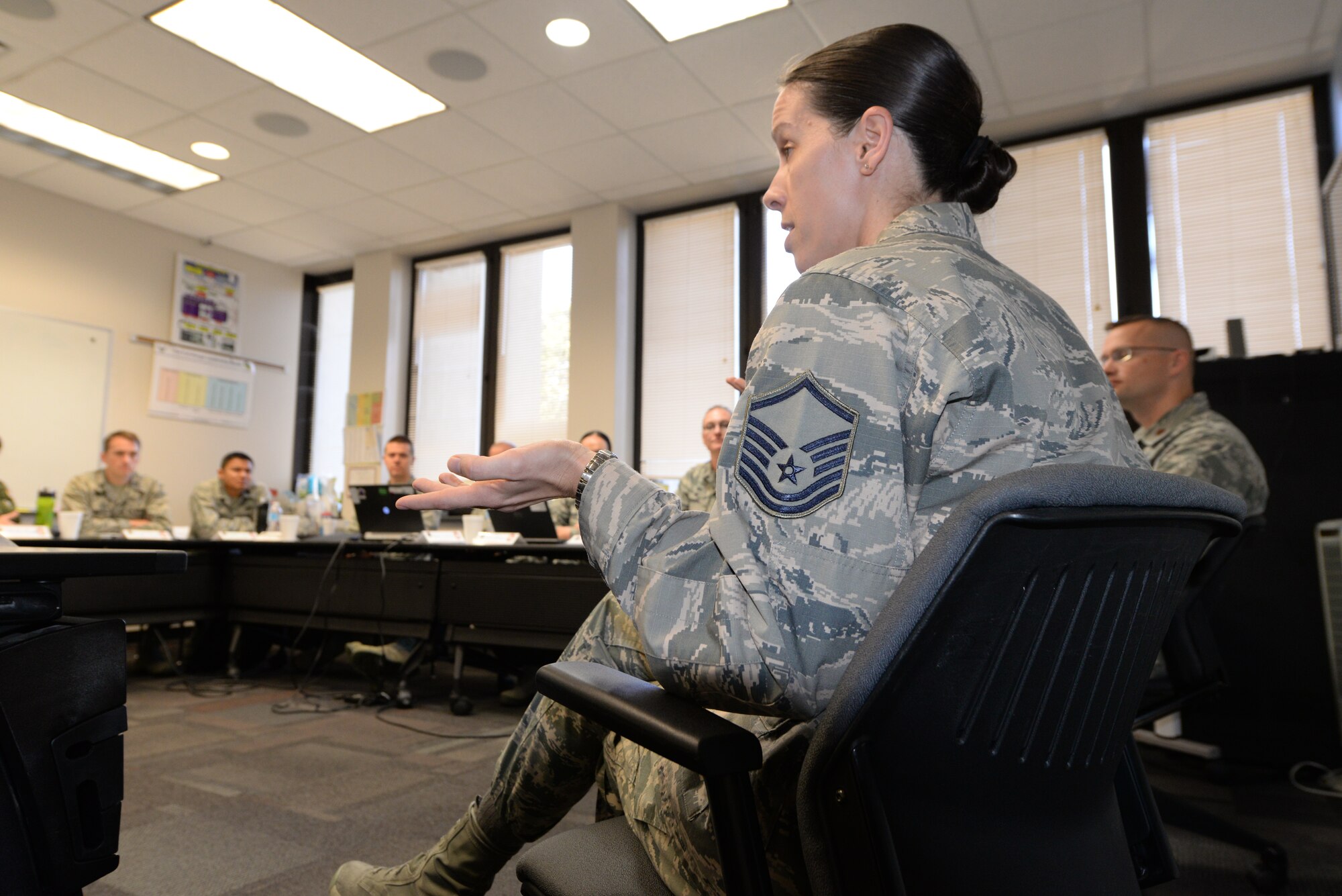 Master Sgt. Erin Panas, Airman Leadership School Programs superintendent, speaks with Squadron Officer School students during SOS Senior Non-Commissioned Officer Perspective education Dec. 7, 2015, at Maxwell Air Force Base, Alabama. The lesson occurs during each of the seven SOS classes annually to provide insight of enlisted career development and issues facing the enlisted force to SOS students. (U.S. Air Force photo by Airman 1st Class Alexa Culbert)