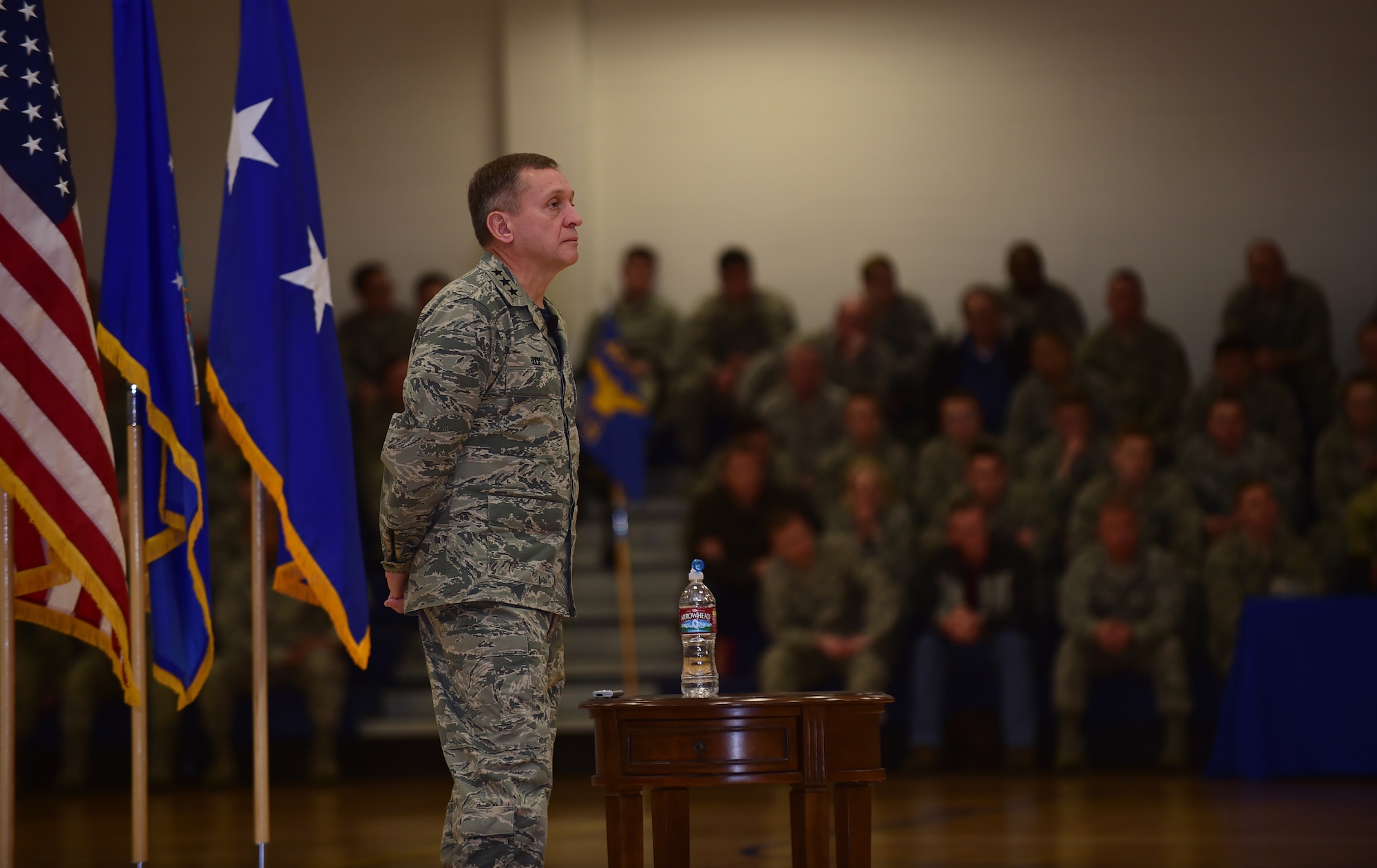 Lt. Gen. David J. Buck, Commander, 14th Air Force (Air Forces Strategic), Air Force Space Command; and Commander, Joint Functional Component Command for Space, U.S. Strategic Command, listens as Chief Master Sgt. Craig A. Neri, Command Chief Master Sergeant, 14th Air Force (Air Forces Strategic), Air Force Space Command; and Command Senior Enlisted Leader, Joint Functional Component Command for Space, U.S. Strategic Command, speaks during a commander’s call Jan. 15, 2016, at Buckley Air Force Base, Colo. Buck visited base facilities and met with members of Team Buckley to discuss the 460th Space Wing mission. (U.S. Air Force photo by Airman 1st Class Gabrielle Spradling)