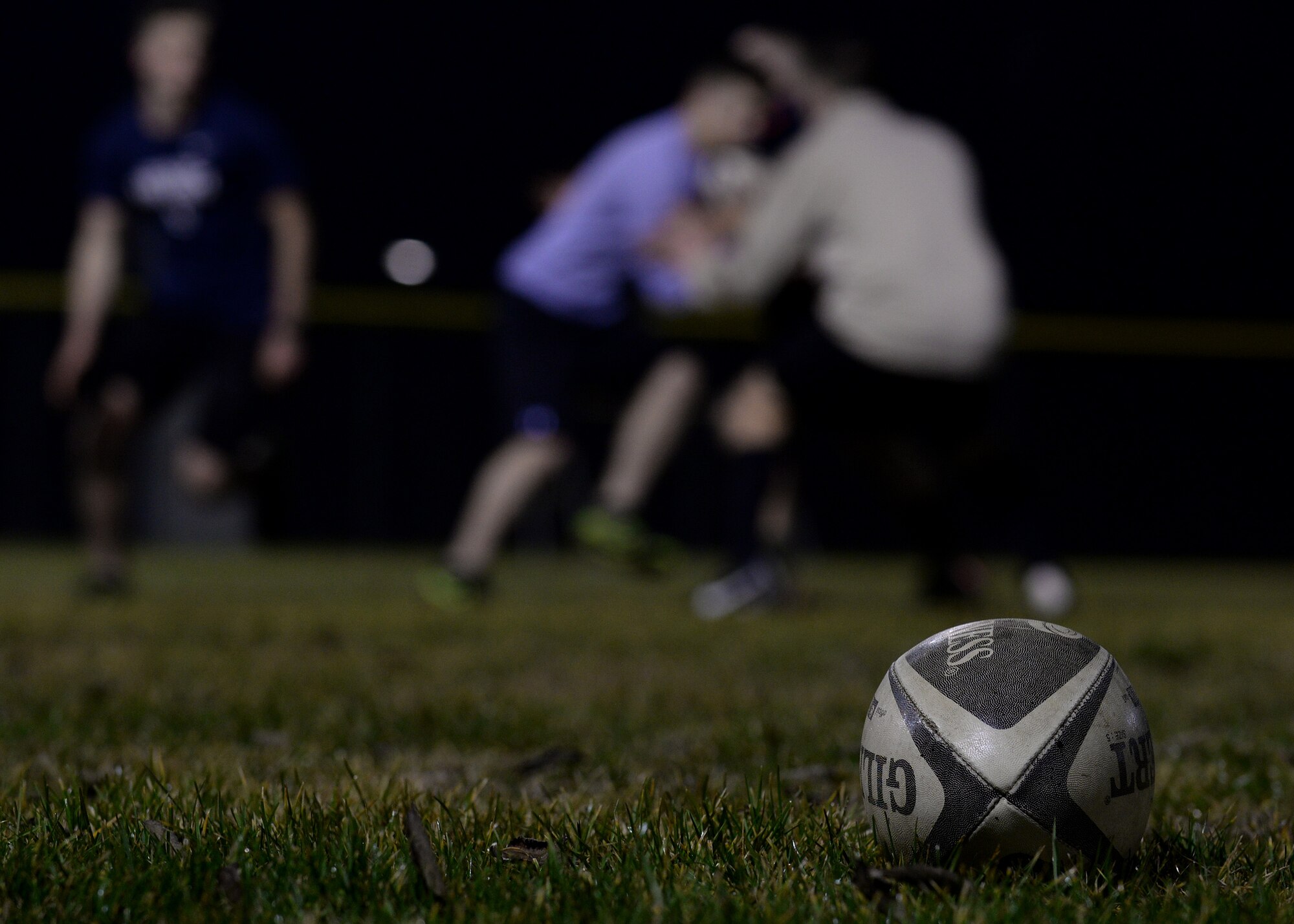 U.S. Air Force Airmen perform offensive and defensive drills during rugby practice, Jan. 12, 2016, at Aviano Air Base, Italy. The team will compete against local Italian rugby teams and possibly teams throughout Europe. (U.S. Air Force photo by Airman 1st Class Cary Smith/Released)