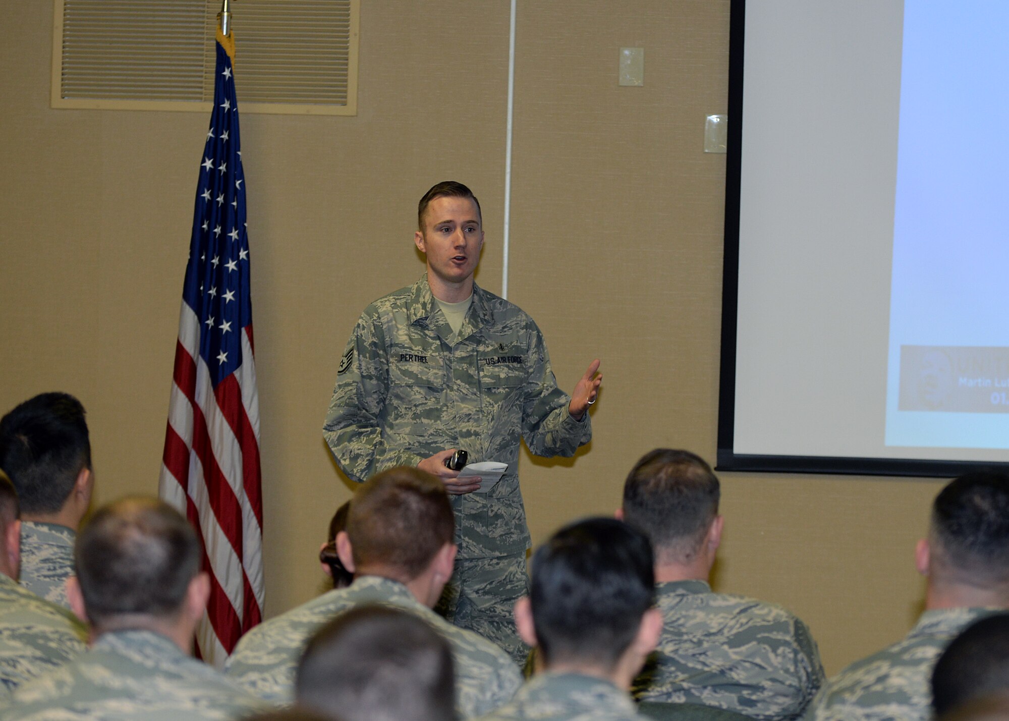 Staff Sgt. Erik Perthel, 28th Medical Operations Squadron public health technician, speaks about Martin Luther King, Jr. Day of Observance at Ellsworth Air Force Base, S.D., Jan. 12, 2016. Approximately 59 Airmen attended the briefing to learn the meaning behind the holiday. (U.S. Air Force photo by Airman Sadie Colbert/Released)