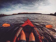 Senior Airman Sara Yandell, 319th Security Forces Squadron military working dog handler, kayaks at Scenic State Park in Minnesota. Yandell describes herself as an “outdoorsy” person, and reassures others who come to Grand Forks that there is plenty here to keep them busy. (Courtesy photo taken by Senior Airman Sara Yandell)