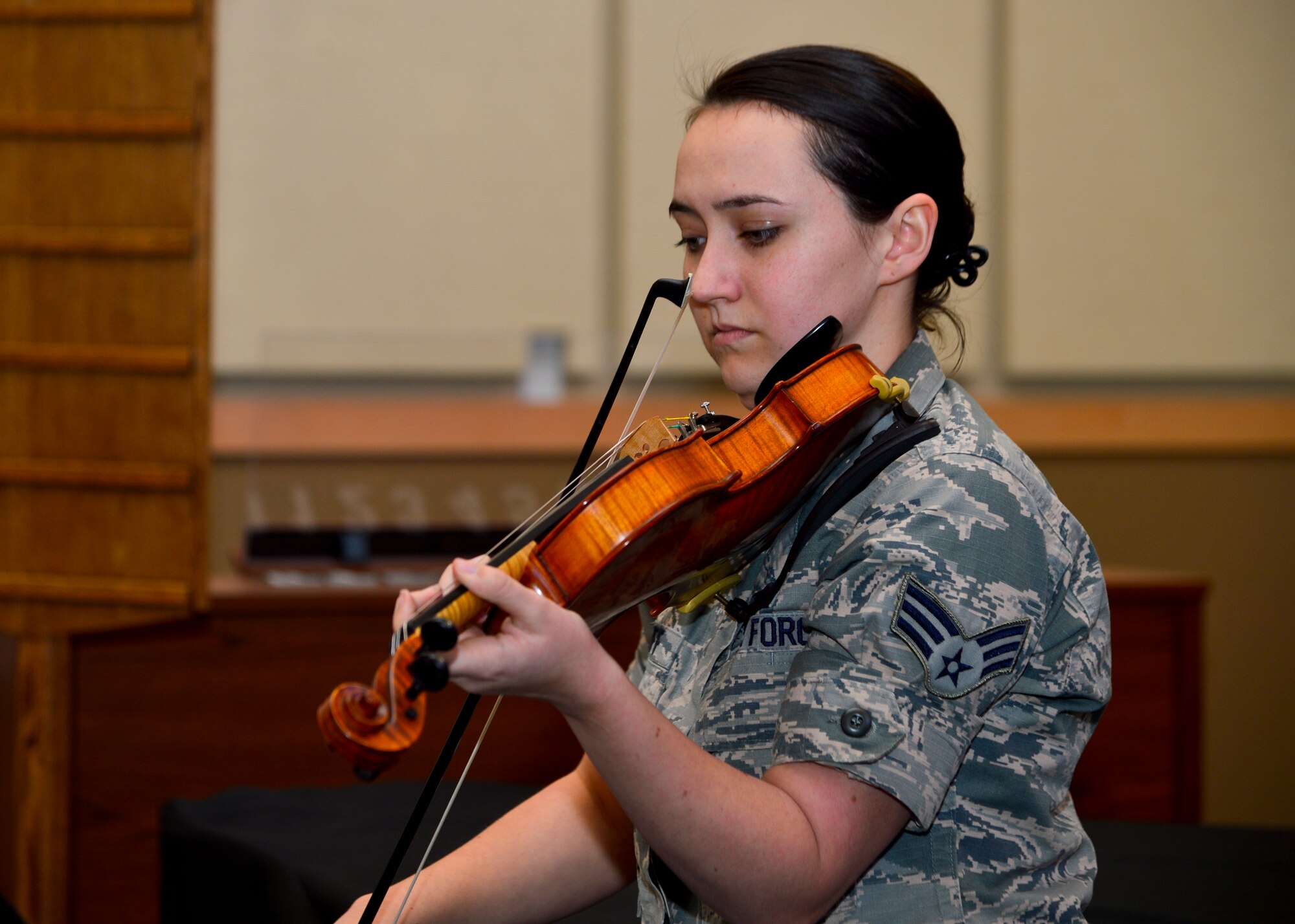 Senior Airman Emily Ratliff, 436th Logistics Readiness Squadron individual protective equipment, plays the national anthem on her violin at the start of the Dr. Martin Luther King, Jr. Commemorative Ceremony Jan. 14, 2016, at Chapel 1 on Dover Air Force Base, Del. The ceremony featured a video of Team Dover members and the famous “I Have a Dream” speech by Dr. Martin Luther King, Jr. (U.S. Air Force photo/Senior Airman William Johnson)