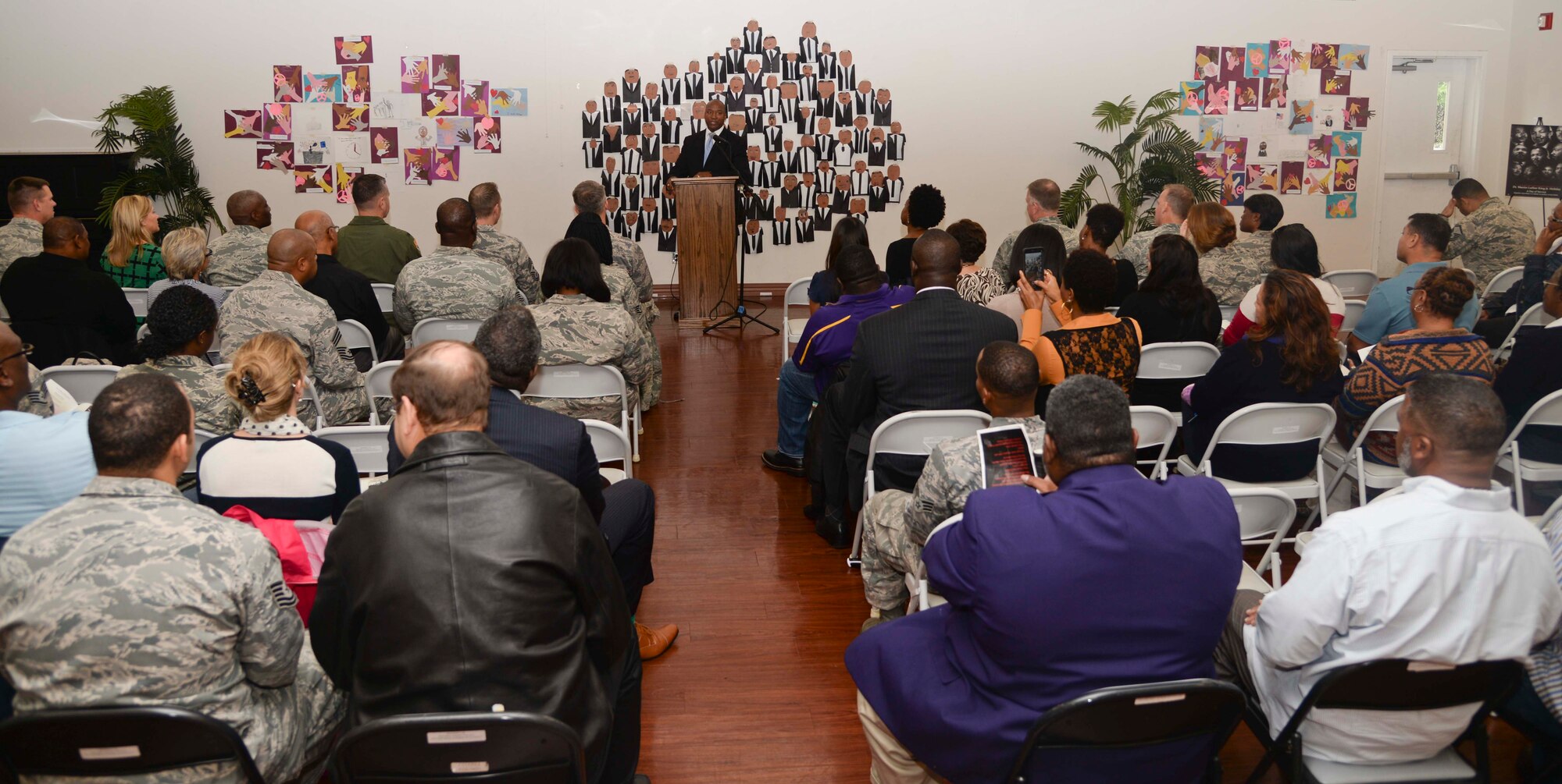 Retired Chief Master Sgt. Derrick Crowley delivers a speech during a Martin Luther King Jr. Special Observance event at MacDill Air Force Base, Fla., Jan. 15, 2015. Approximately 100 people came out to support the event. (U.S. Air Force photo by Senior Airman Vernon L. Fowler Jr.)