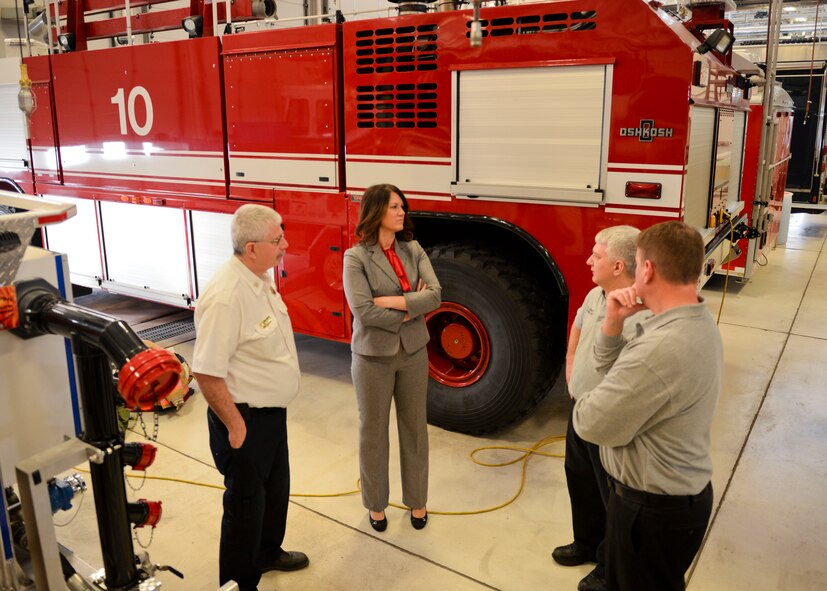 C.J. Cavern, former Minot city fire chief (left), Kelli Flermoen, Minot city fire chief, Paul Lambert, 5th Civil Engineer Squadron assistant chief for training, and Paul Klug, 5th CES assistant fire chief, discuss manpower and equipment at Minot Air Force Base, N.D., Jan. 5, 2016. Team Minot welcomes Kelli Flermoen, Minot city’s new fire chief. (U.S. Air Force photo/Airman 1st Class J.T. Armstrong)