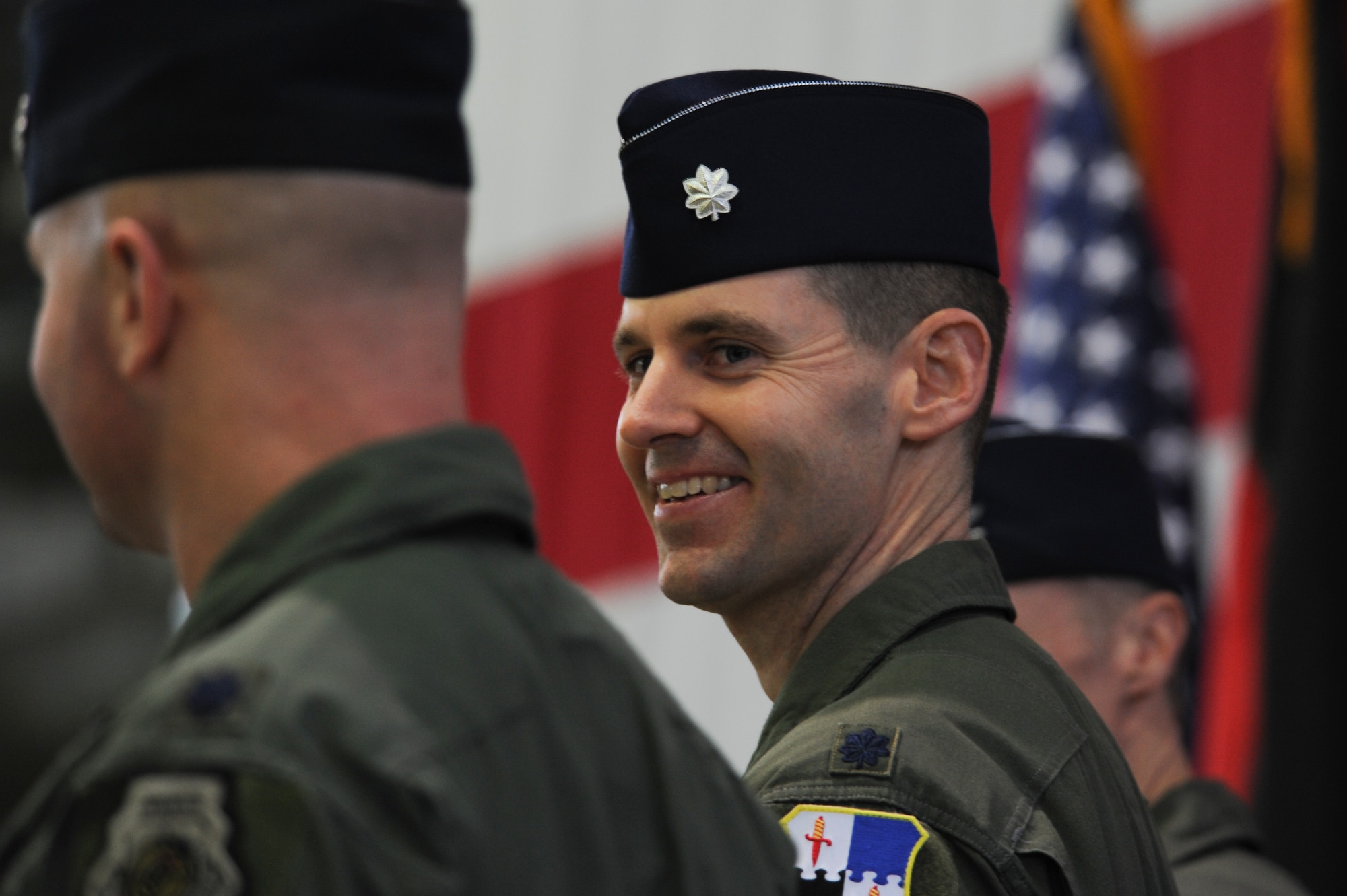U.S. Air Force Lt. Col. Timothy Murphy, 480th Fighter Squadron commander, smiles to his family during a change of command ceremony at Hangar One on Spangdahlem Air Base, Germany, Jan. 15, 2016. Murphy assumed command of the squadron, nicknamed ‘Warhawk Nation,’ from outgoing commander U.S. Air Force Lt. Col. David Berkland. (U.S. Air Force photo by Staff Sgt. Joe W. McFadden/Released)