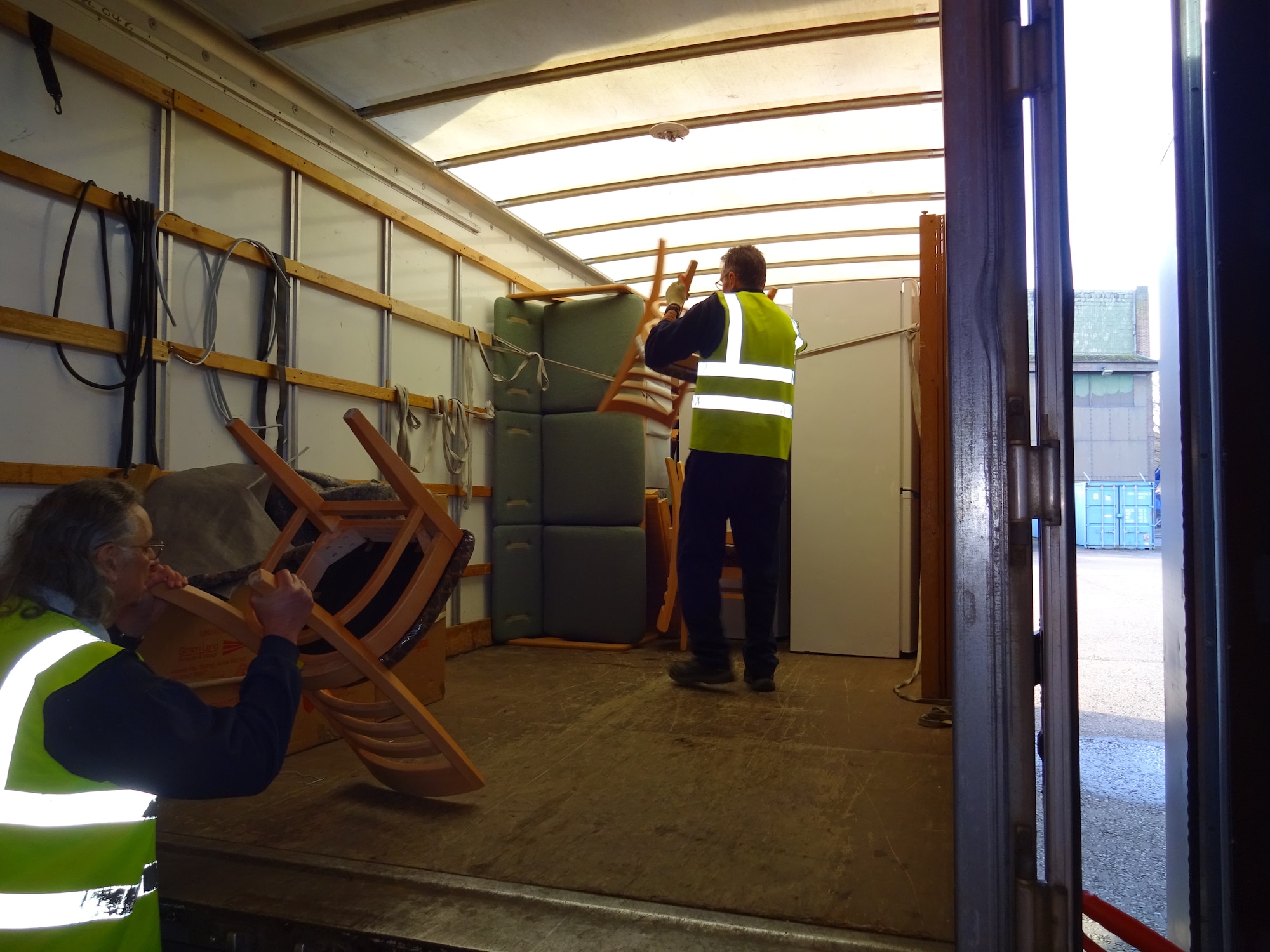 Workers from Arrowdene Moving & Storage in Thetford deliver new appliances at Royal Air Force Lakenheath, England, Jan. 13, 2016. The 48th Contracting Squadron has been working to educate as many local vendors as they can reach about the processes necessary to work with the U.S. Air Force by meeting up with vendors face-to-face at vendor fairs. (Courtesy Photo)