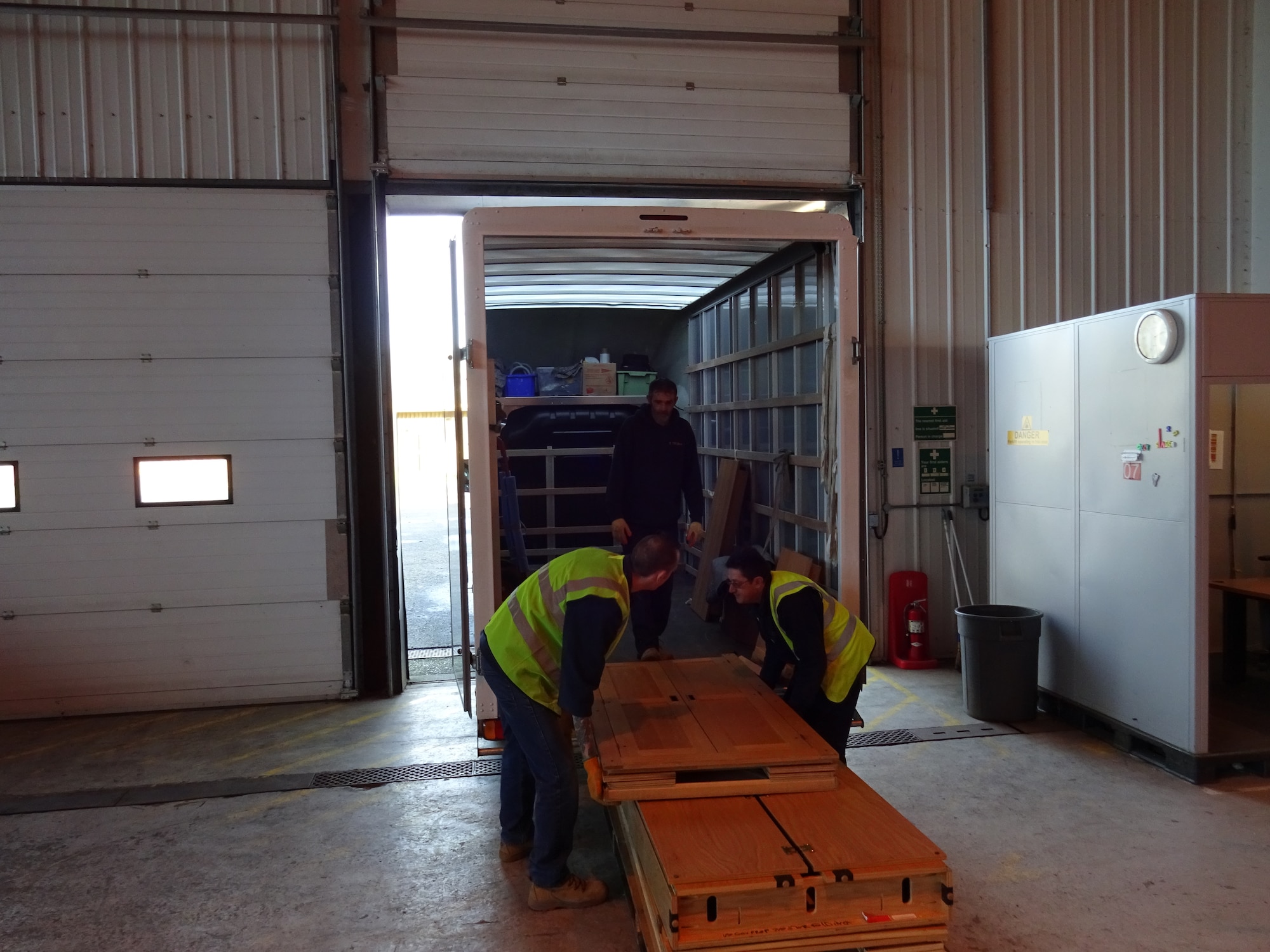 Workers from Arrowdene Moving & Storage in Thetford deliver new appliances at Royal Air Force Lakenheath, England, Jan. 13, 2016. Working with the local community is vital in accomplishing the mission of the 48th Fighter Wing. (Courtesy Photo)