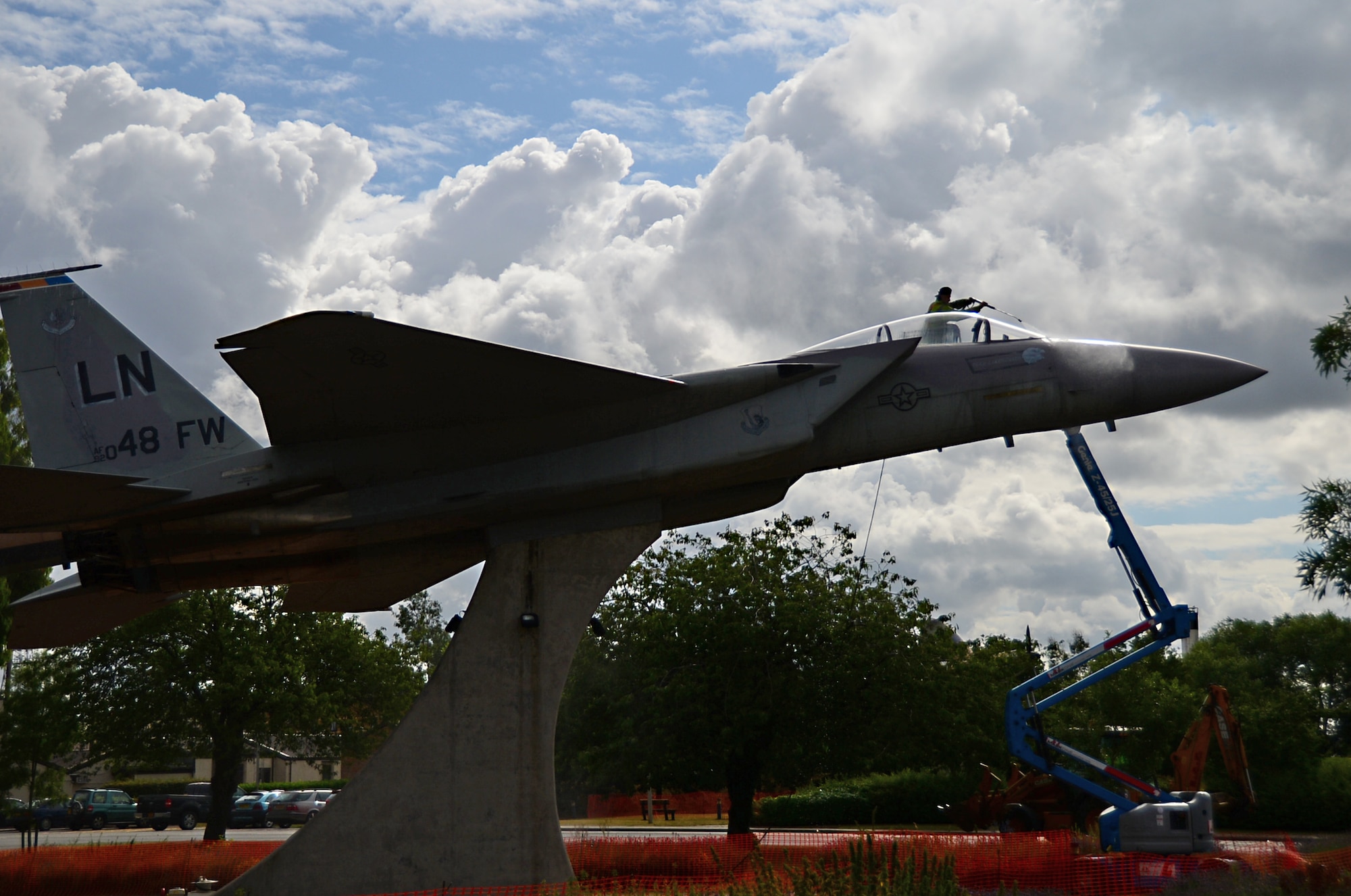 Workers from Fangeos Painting and Decorating Contractors in Essex pressure wash the static displays before repainting them at Royal Air Force Lakenheath, England, July 22, 2015. The 48th Contracting Squadron has been working to educate as many local vendors as they can reach about the processes necessary to work with the U.S. Air Force by meeting up with vendors face-to-face at vendor fairs.  (U.S. Air Force photo by Senior Airman Erin Trower/Released)