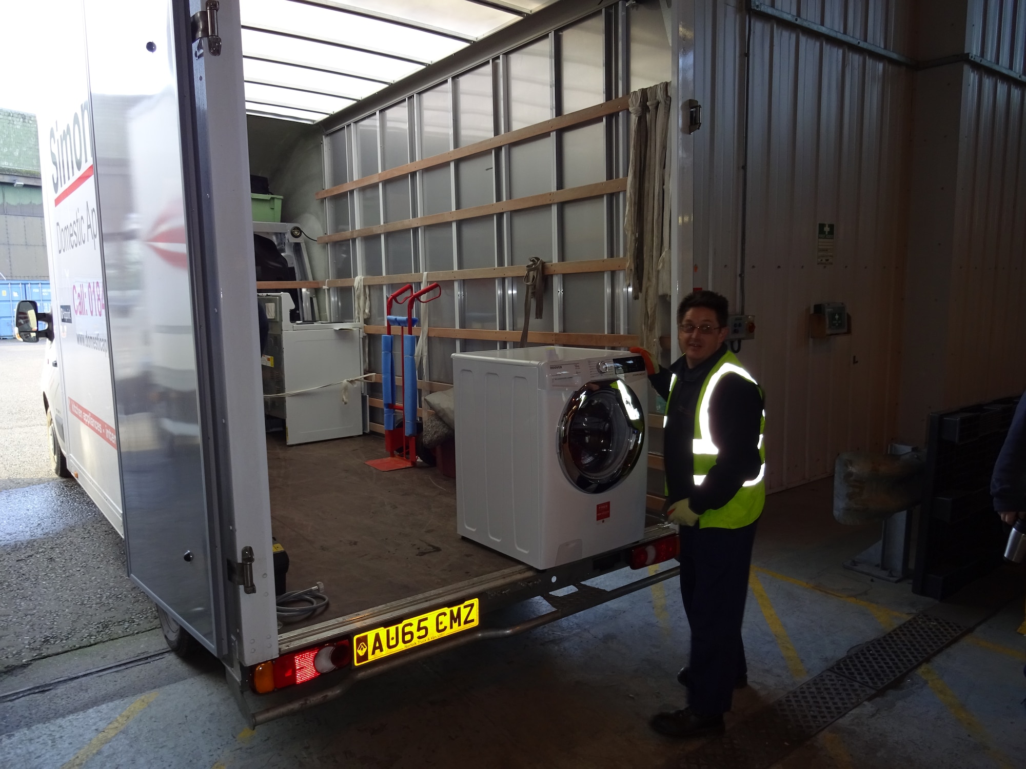 Workers from Arrowdene Moving & Storage in Thetford deliver new appliances at Royal Air Force Lakenheath, England, Jan. 13, 2016. Setting local businesses up with work on RAF Lakenheath has opened up local vendors’ options to work with U.S. agencies all across Europe. (Courtesy Photo)
