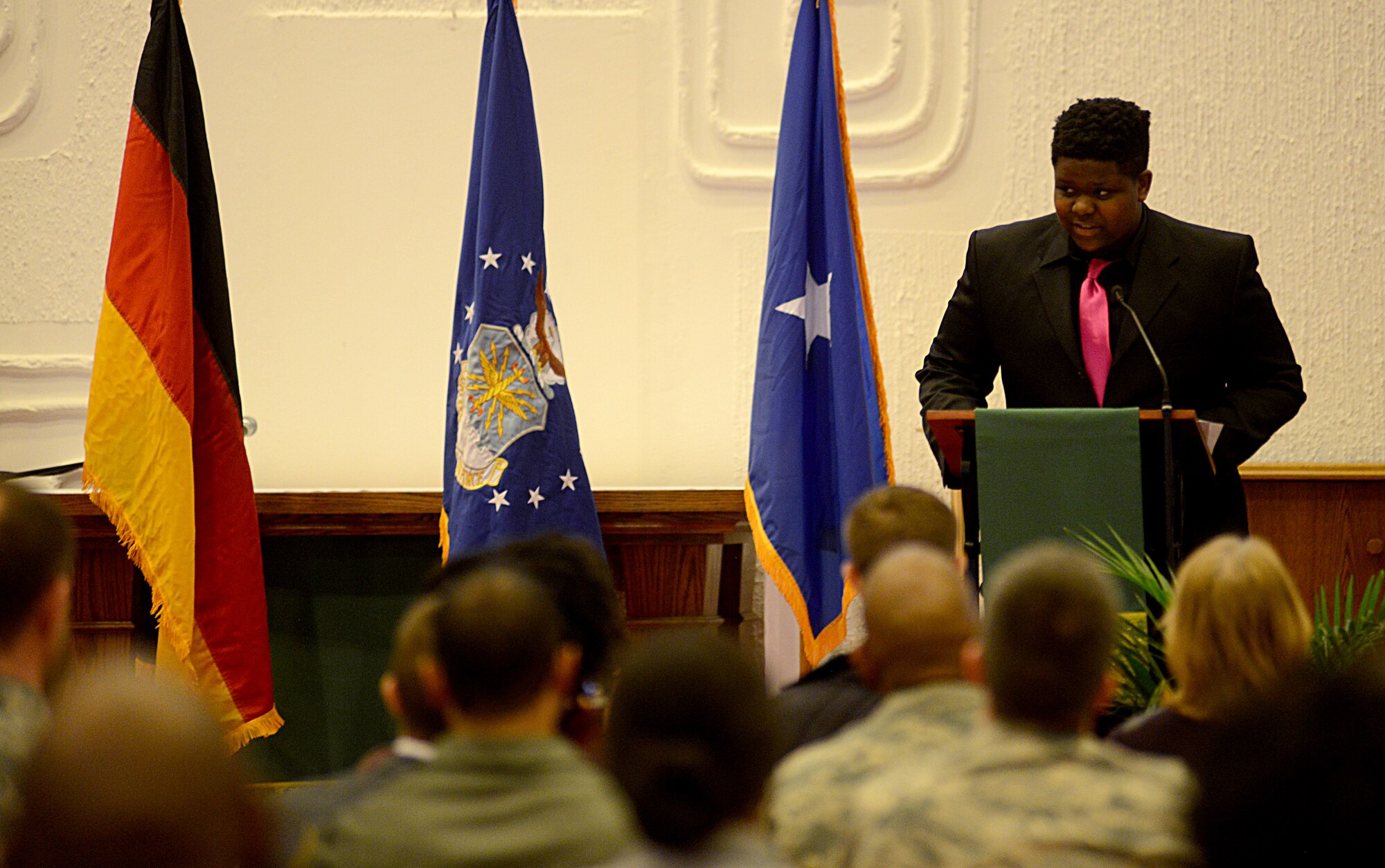 Solomon Udo-Aka, a Ramstein High School freshman, presents his first-place winning oratorical speech during a Martin Luther King Jr. observance ceremony Jan. 12, 2016, at Ramstein Air Base, Germany. Udo-Aka’s speech focused on King’s life and work as an inspiration and servant to others. (U.S. Air Force photo/Staff Sgt. Timothy Moore)