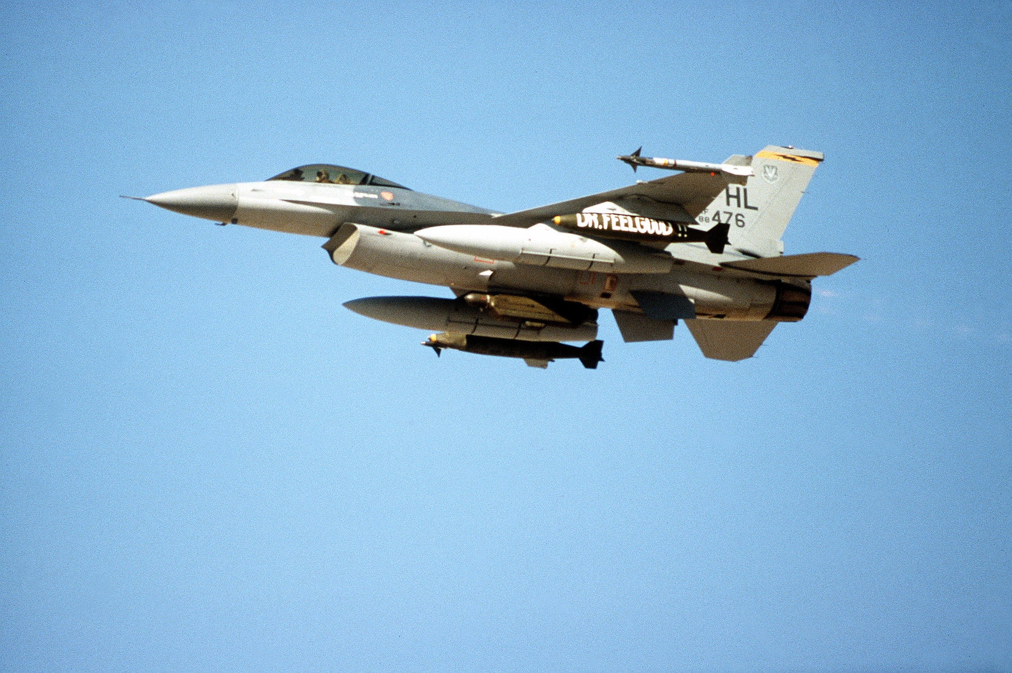 An F-16C Fighting Falcon aircraft of the 388th Tactical Fighter Wing flies out on a mission during Operation Desert Storm.  The aircraft is armed with AIM-9 Sidewinder missiles and Mark 84 2,000-pound bombs. (U.S. Air Force photo)