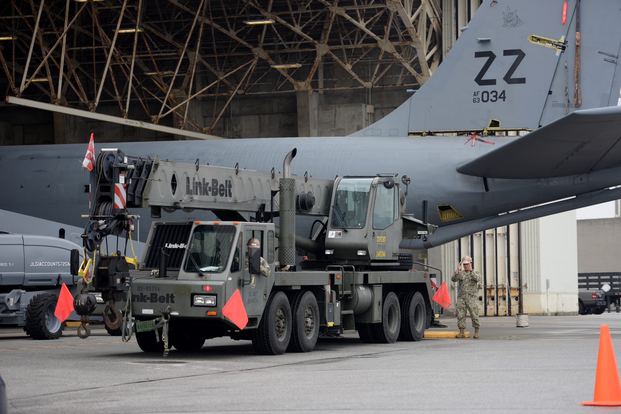 U.S Navy Equipment Operator 3rd Class Zachary Williams and EO 3rd Class Aaron Talosig, Naval Mobile Construction Battalion 3 Seabees construction men, maneuver a Link Belt 40-ton crane into position Jan. 14, 2016, at Kadena Air Base, Japan. The Seabees arrived on scene with a specialized crane to enable U.S. Air Force maintainers to lift off the tail section of a KC-135 Stratotanker for rudder repairs. (U.S. Air Force photo by Senior Airman Peter Reft)