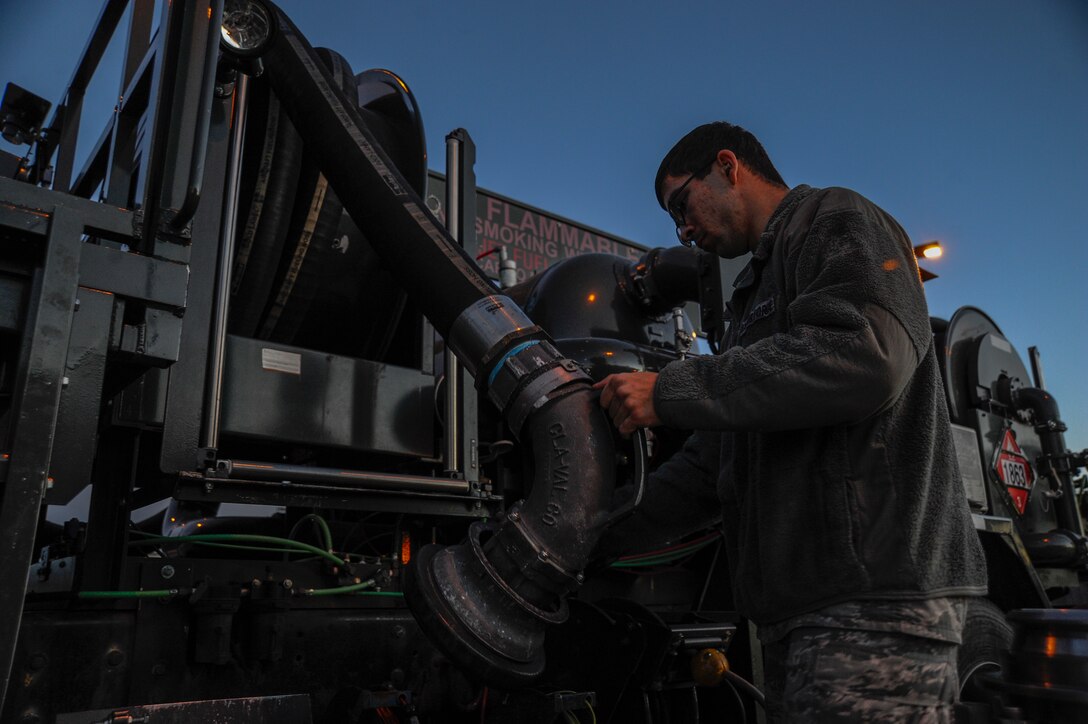 Airman 1st Class Zachary Smith, 22nd Logistics Readiness Squadron fuels distribution, disconnects a hose at a fuel distribution test stand after checking the vehicle for equipment leaking fuel, Jan. 14, 2016, at McConnell Air Force Base, Kan. Fuels distribution Airmen perform routine inspections on the vehicles to ensure the fleet is in good operating condition thereby enabling the aerial refueling mission to continue. (U.S. Air Force photo/Airman Jenna K. Caldwell) 