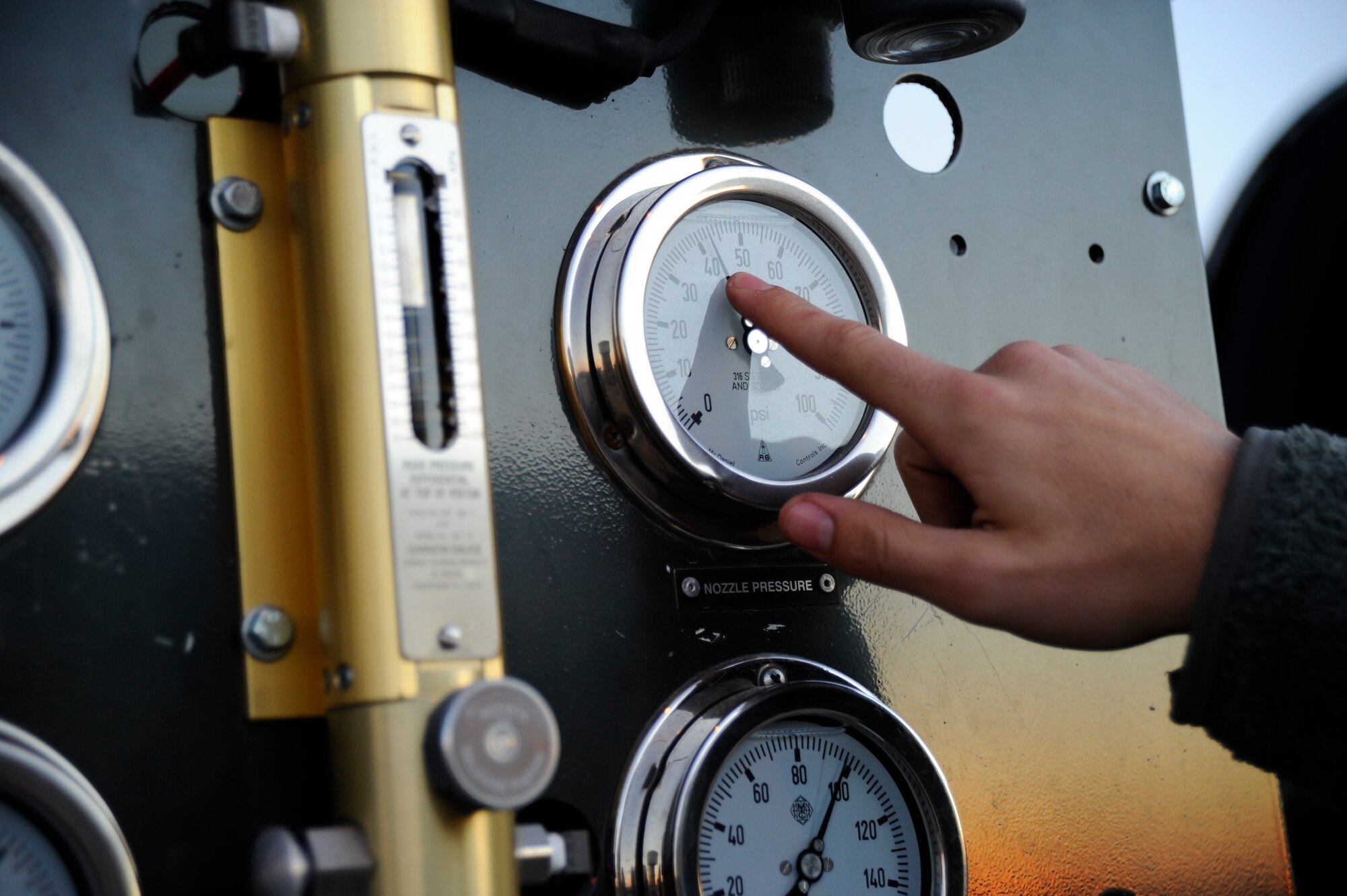 Airman 1st Class Zachary Smith, 22nd Logistics Readiness Squadron fuels distribution, checks pressure gauges on the test stand, Jan. 14, 2016, at McConnell Air Force Base, Kan. Fuels distribution Airmen routinely inspect the vehicle fleet to ensure all assets are maintained for mission readiness. (U.S. Air Force photo/Airman Jenna K. Caldwell) 