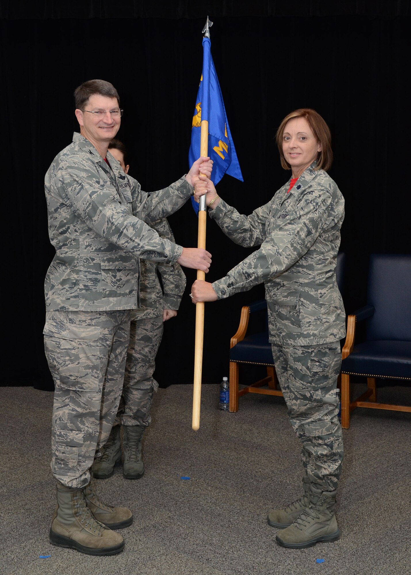 Lt. Col. Patti Fries receives the 131st Medical Group guidon from Col Mike Francis, 131st Bomb Wing Commander, during the assumption of command ceremony at Whiteman Air Force Base, Missouri, Jan 10. “You deserve nothing less than my best, and I’ll give it to you, that is my promise,” said Fries.
(U.S. Air National Guard photo by Staff Sgt. Brittany Cannon)
