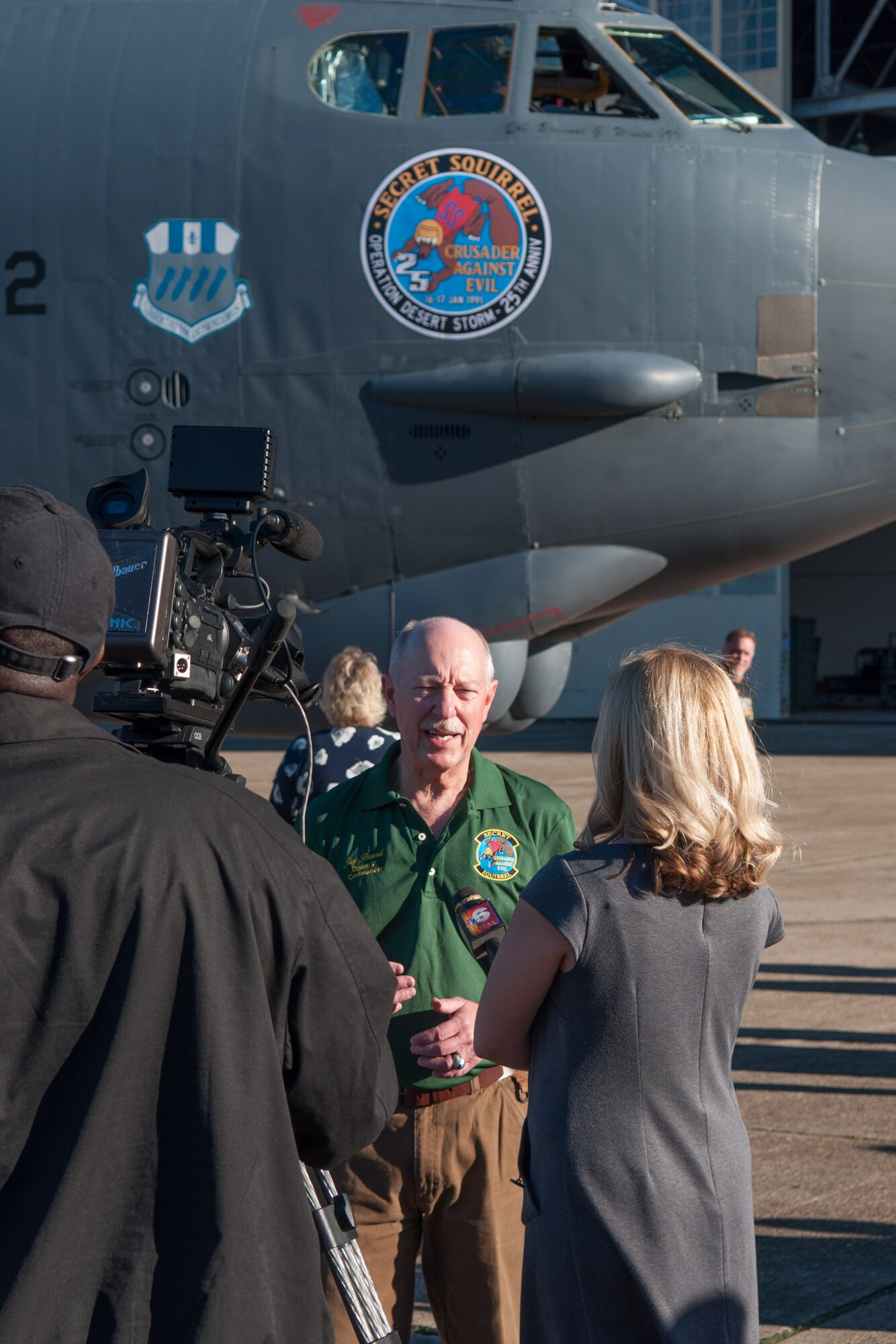 John Beard, the mission commander of Operation Senior Surprise, aka “Secret Squirrel,” speaks with a local news reporter on Barksdale Air Force Base, La. on Jan. 15, 2016. Beard reunited with his fellow Airmen for the 25th anniversary of the mission that kicked off Operation Desert Storm. During the 35-hour long mission, 35 cruise missiles were launched from seven B-52s targeting strategic and tactical targets in Iraq. (U.S. Air Force photo by Master Sgt. Dachelle Melville/Released)