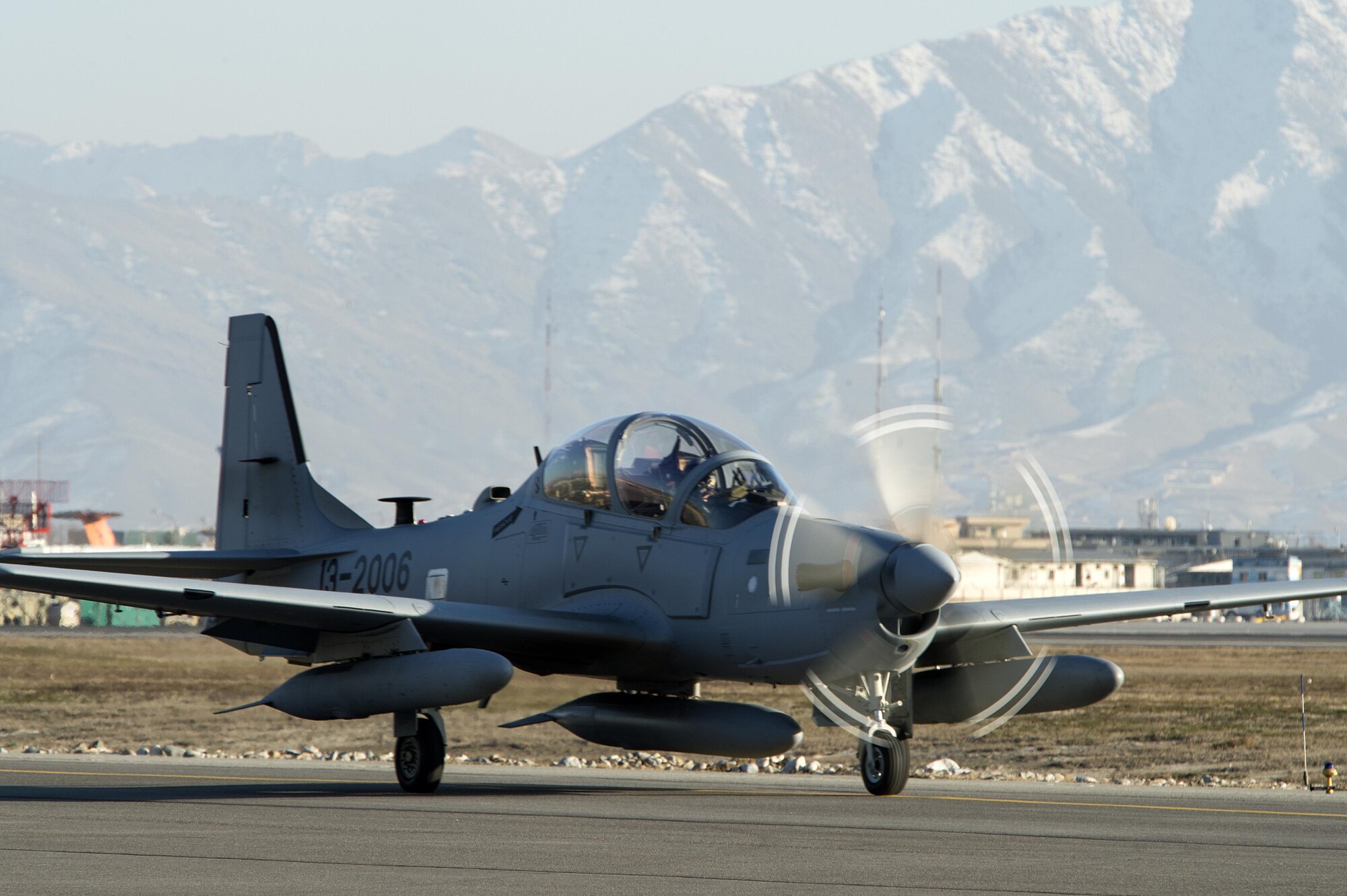 An A-29 Super Tucano taxis across the airfield at Hamid Karzai International Airport, Afghanistan, Jan. 15, 2016. The aircraft will be added to the Afghans' inventory in the spring of 2016. The A-29 Super Tucano is a 'light air support' aircraft capable of conducting close air support, aerial escort, armed overwatch and aerial interdiction. Designed to operate in high temperature and in extremely rugged terrain, the A-29 Super Tucano is highly maneuverable 4th generation weapons system capable of delivering precision guided munitions. It can fly at low speeds and low altitudes, is easy to fly, and provides exceptionally accurate weapons delivery. It is currently in service with 10 different air forces around the world. (U.S. Air Force photo by Tech. Sgt. Nathan Lipscomb)