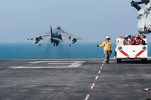 (Dec. 29, 2015) Aviation Boatswain's Mate (Handling) 3rd Class Sarahkate Barambangan, from Los Angeles, directs an AV-8B Harrier to take off from the flight deck of the amphibious assault ship USS Kearsarge (LHD 3). Kearsarge is the flagship for the Kearsarge Amphibious Ready Group (ARG) and, with the embarked 26th Marine Expeditionary Unit (26th MEU), is deployed in support of maritime security operations and theater security cooperation efforts in the U.S. 5th Fleet area of operations. 