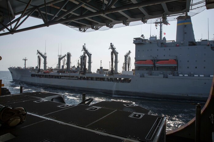 (Jan. 12, 2016) The Military Sealift Command fleet replenishment oiler USNS John Lenthall (T-AO 189) transits alongside the amphibious assault ship USS Kearsarge (LHD 3). Kearsarge is the flagship for the Kearsarge Amphibious Ready Group (ARG) and, with the embarked 26th Marine Expeditionary Unit (MEU), is deployed in support of maritime security operations and theater security cooperation efforts in the U.S. 5th Fleet area of operations.
