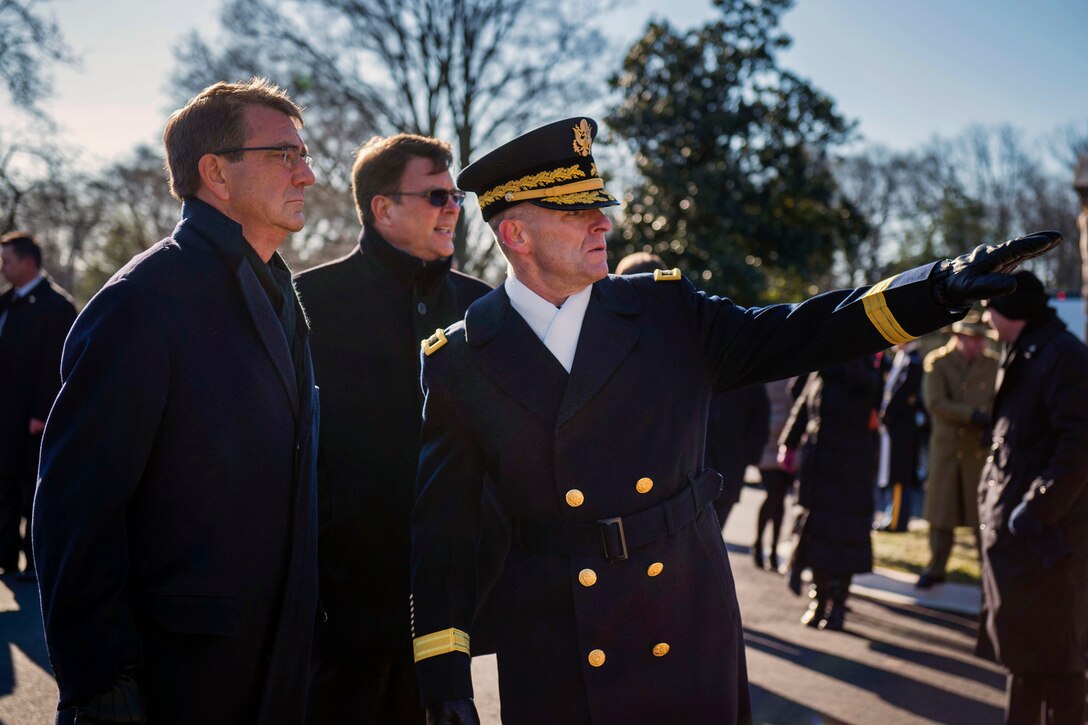 Defense Secretary Ash Carter is briefed on the order of events as he prepares to take part in a wreath-laying ceremony with Australian Prime Minister Malcolm Turnbull at the Tomb of the Unknown Soldier at Arlington National Cemetery, Arlington, Va., Jan. 18, 2016. DoD photo by Senior Master Sgt. Adrian Cadiz