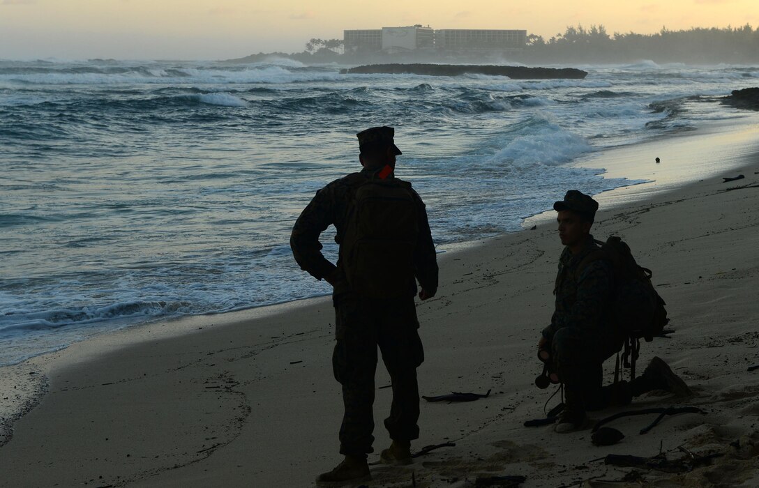 Marines report a piece of debris to the Haleiwa Incident Command Post during a beach sweep near Turtle Bay Resort in Kahuku, Hawaii, Jan. 17, 2016. The Marines are assisting the Coast Guard and other first responders with search and rescue efforts for 12 missing Marines from a helicopter crash along the North Shore of Oahu. (U.S. Coast Guard photo by Petty Officer 1st Class Levi Read/Released)