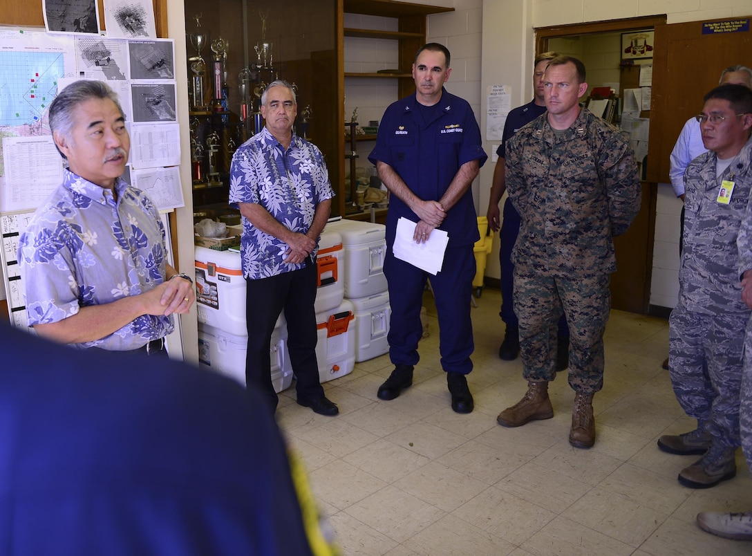 Hawaii Gov. David Y. Ige speaks to leaders of the Haleiwa Incident Command Post in Haleiwa, Hawaii, Jan. 18, 2016. Ige visited the post to thank those involved in the search for 12 missing Marine pilots involved in a helicopter crash off North Shore of Oahu. U.S. Coast Guard photo by Petty Officer 1st Class Levi Read