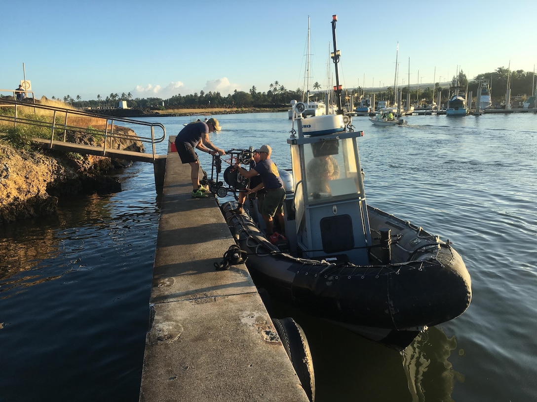 Sailors prepare to continue search efforts from Haleiwa, Hawaii, Jan. 18, 2016, for 12 missing Marine pilots. The operation is part of the joint rescue effort following the mishap involving two Marine Corps CH-53E Super Stallion helicopters the night of Jan. 14. The sailors are assigned Mobile Diving Salvage Unit 1, Joint Base Pearl Harbor, Hickam, Hawaii.  U.S. Coast Guard photo credit Lt. Kevin Cooper