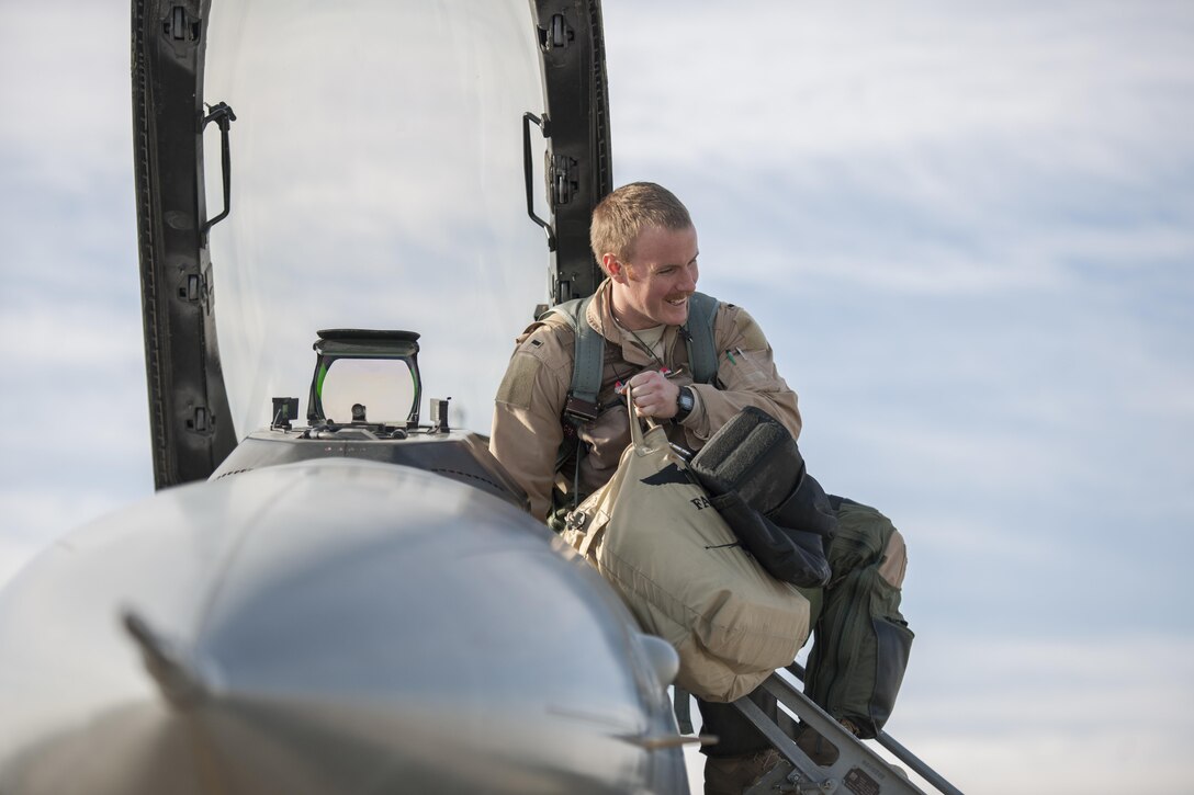 Air Force 1st Lt. Matthew Sanders climbs in to an F-16 Fighting Falcon aircraft before a combat sortie on Bagram Airfield, Afghanistan, Jan. 17, 2016. U.S. Air Force photo by Tech. Sgt. Robert Cloys