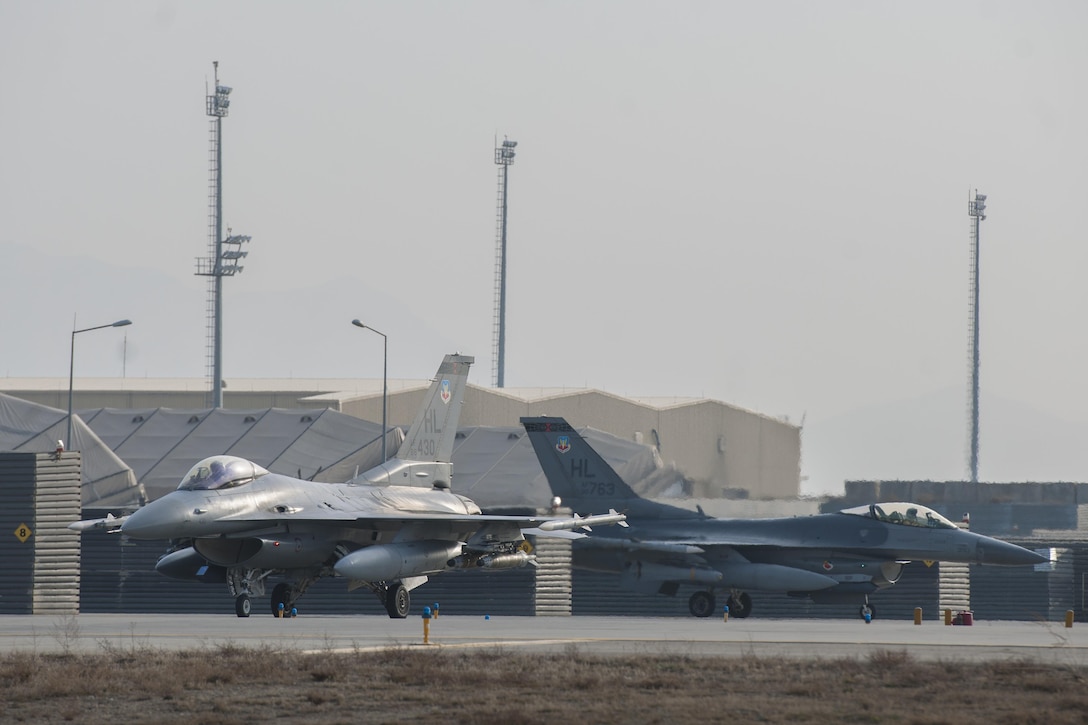 Two F-16 Fighting Falcons on Bagram Airfield, Afghanistan, taxi out to the runway before a combat sortie Jan. 17, 2016. U.S. Air Force photo by Tech. Sgt. Robert Cloys