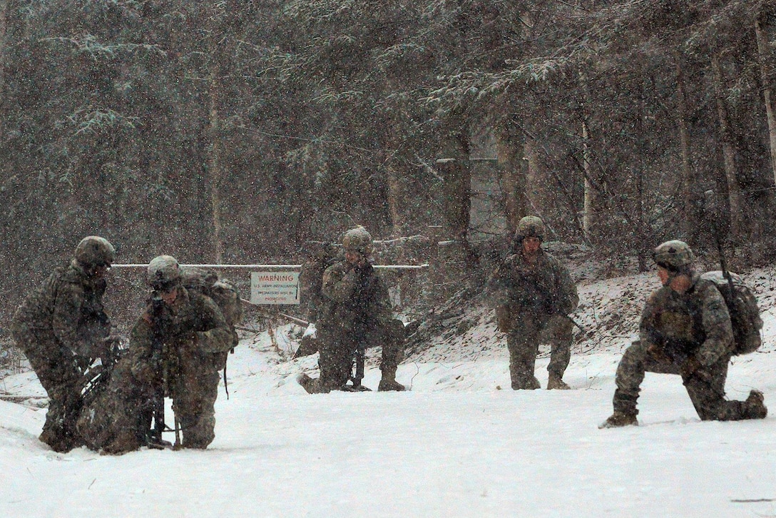 Soldiers prepare to move out on a mission during a light snowfall to participate in a live-fire exercise with mortars on Joint Base Elmendorf-Richardson, Alaska, Jan. 12, 2016. The soldiers are mortarmen assigned to the 1st Battalion, 501st Infantry Regiment. U.S. Army photo by John Pennell