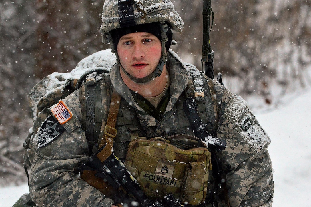 Army Staff Sgt. Ryan Fountain maneuvers through snow during a live-fire exercise on Joint Base Elmendorf-Richardson, Alaska, Jan. 12, 2016. Fountain is a mortarman assigned to Company C, 1st Battalion, 501st Infantry Regiment. U.S. Army photo by John Pennell