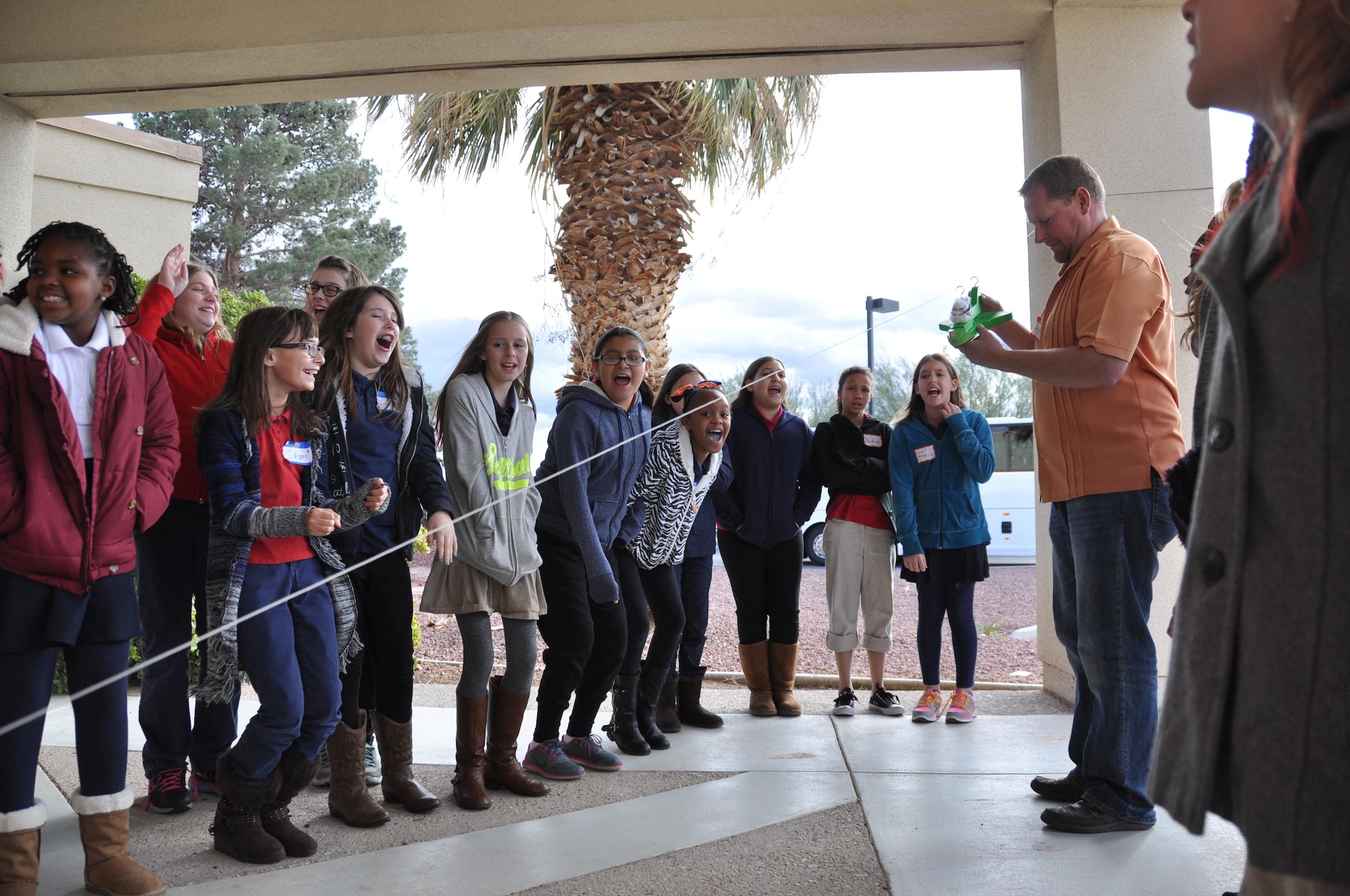Students from Neal Elementary School watch Starbase Nellis director, Myles Judd, conduct the Eggbert experiment here Jan. 8. In the experiment, students construct a safety harness for an egg that allows it to safely fly down a cable with the goal of protecting the egg at the end of the flight. Students had a budget for how much they could spend on the raw materials for the safety harness. Starbase is a Department of Defense educational program, sponsored by the Office of the Assistant Secretary of Defense for Reserve Affairs where students participate in science, technology, engineering and math activities. Students are immersed in a unique classroom experience for five days where all activities are student-centered, hands-on, encourage higher-order thinking and incorporate STEM applications in the real world. (Information collected from dodstarbase.org.) (U.S. Air Force photo/Maj. Jessica D'Ambrosio)
